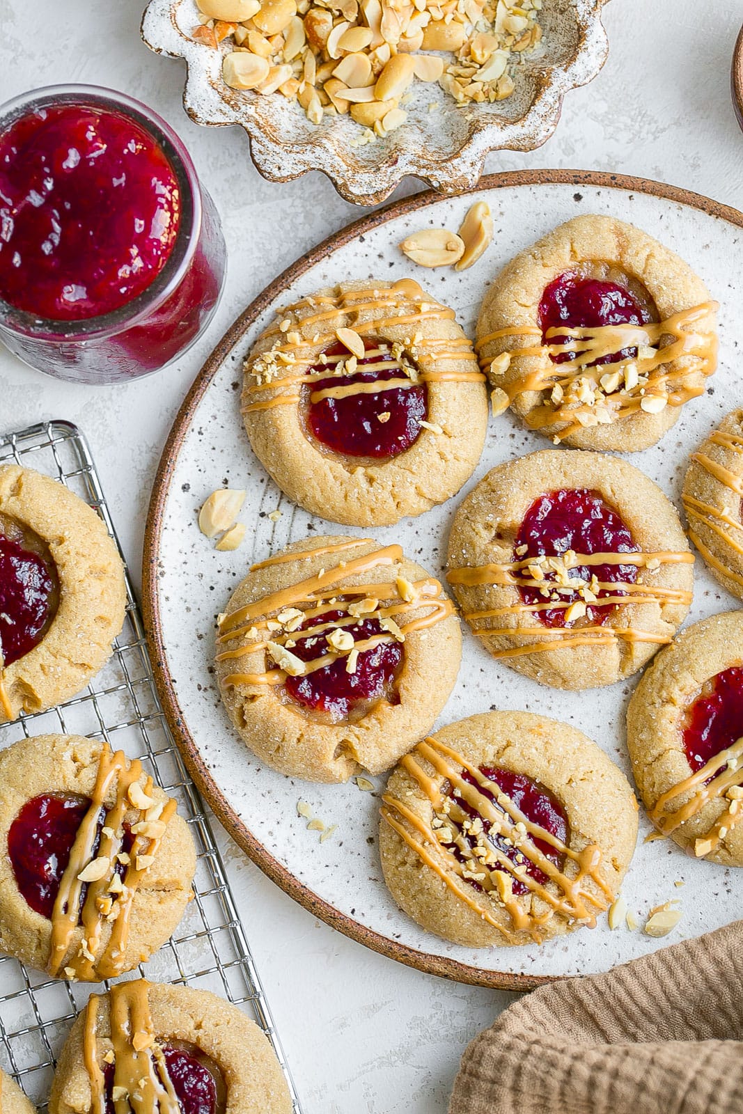 Cookies with jelly on a plate.