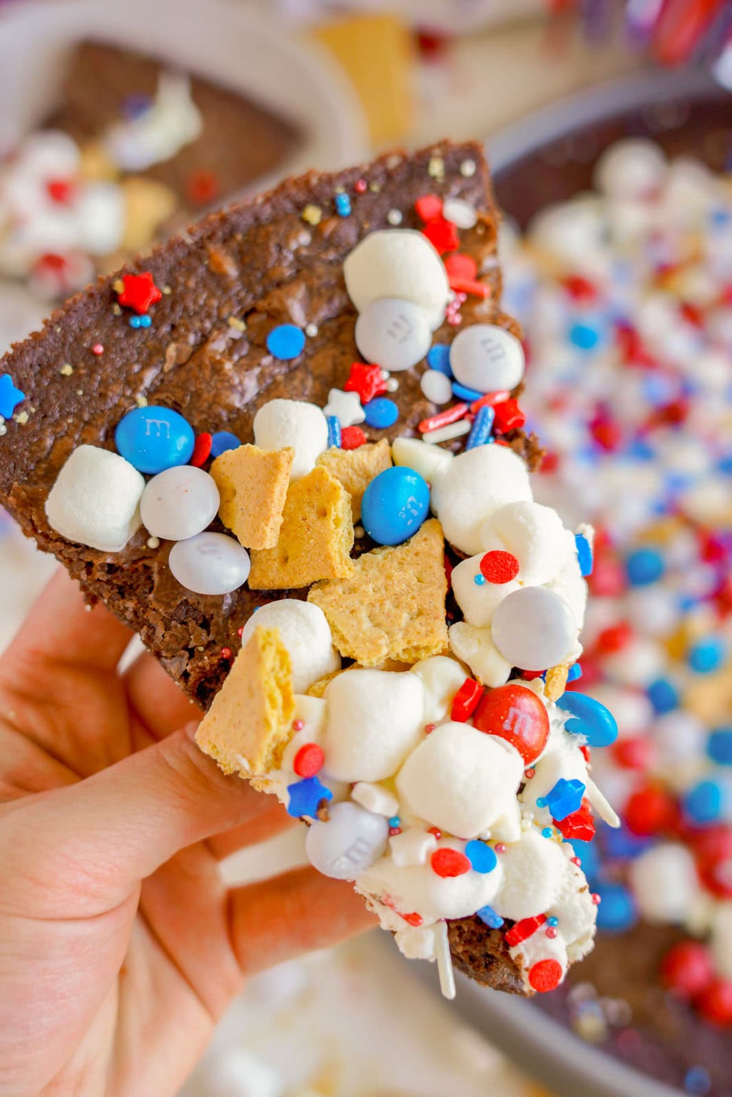 Hand holding patriotic Brownie Pizza.