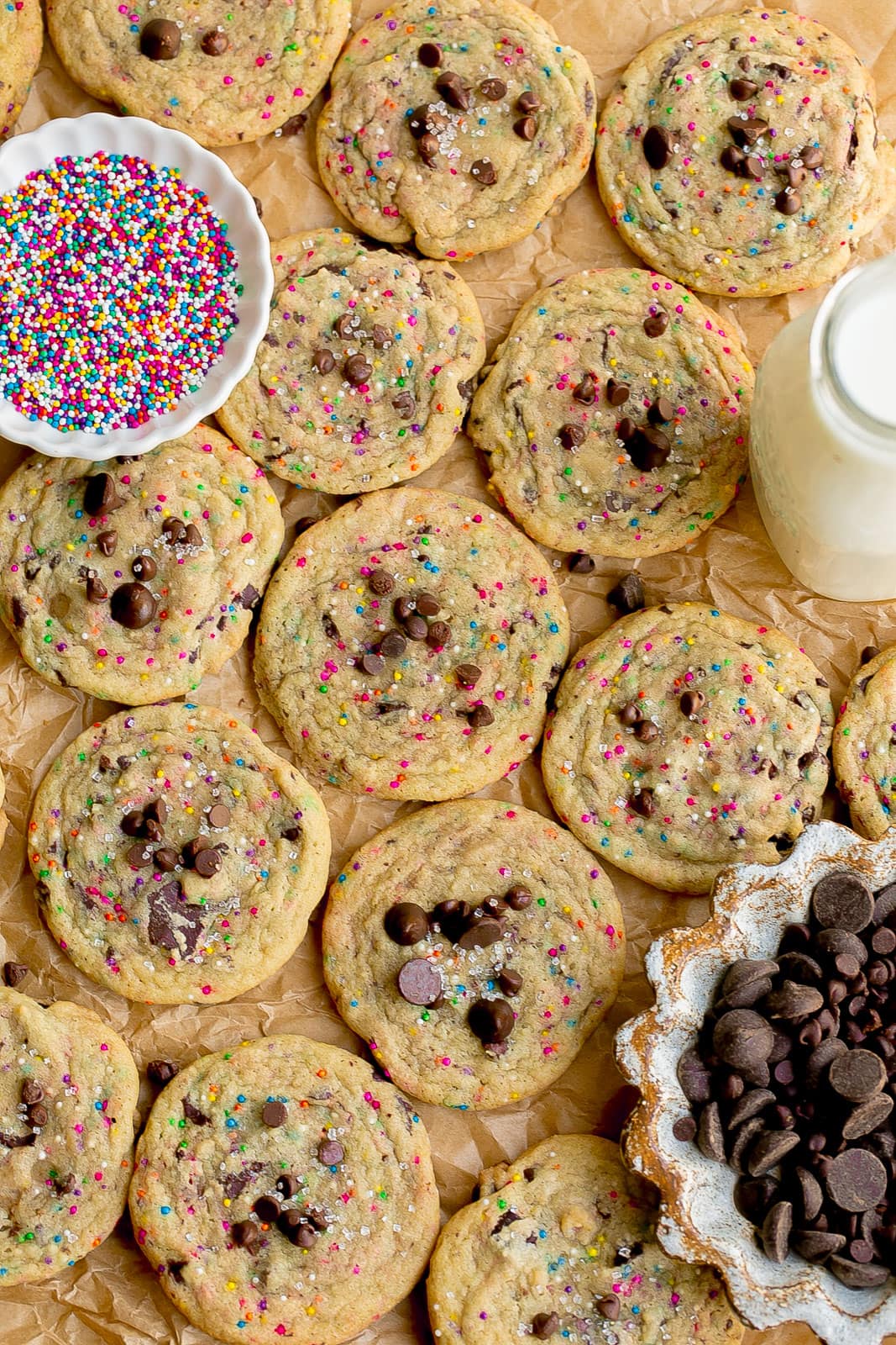 Sugar cookies with chocolate chips on parchment paper.