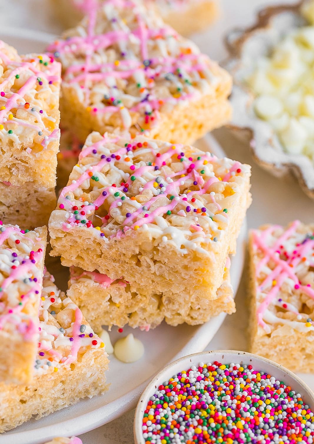 White chocolate krispie treats on a plate.