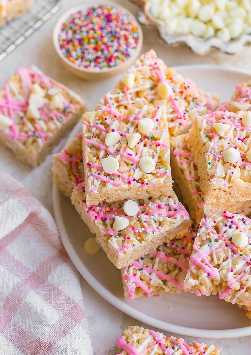 White Chocolate Rice Krispie Treats with rainbow sprinkles on top.