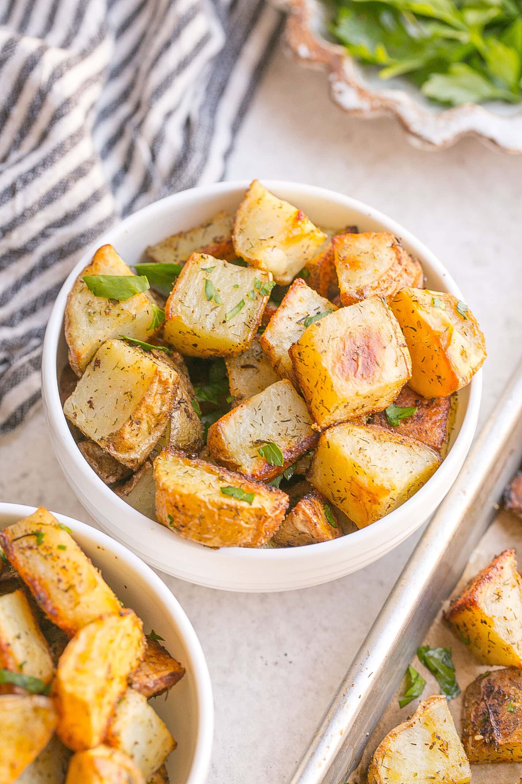 White bowl of Ranch Roasted Potatoes.