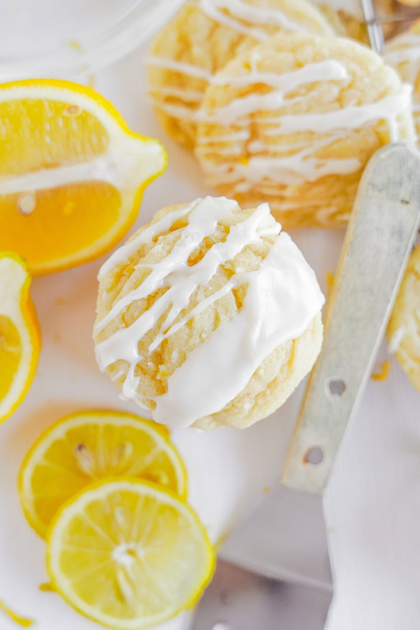 Birds eye view of glazed soft batch lemon cookies.