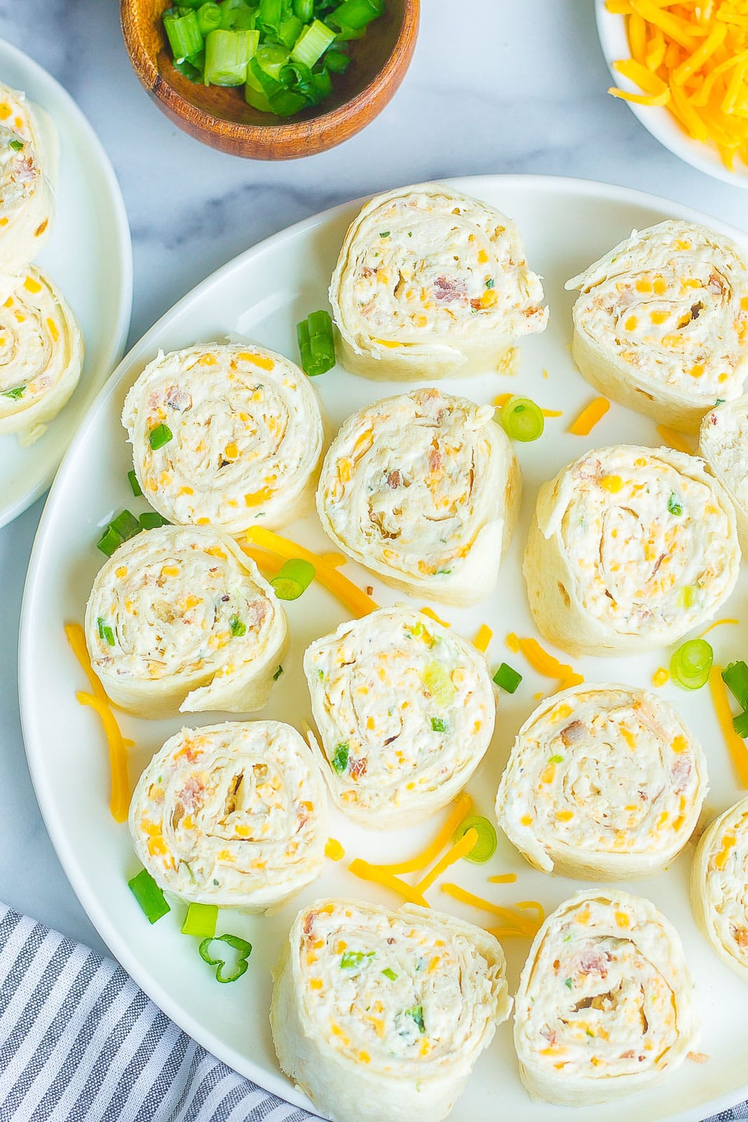 Chicken Bacon Ranch Pinwheels on a white plate. 