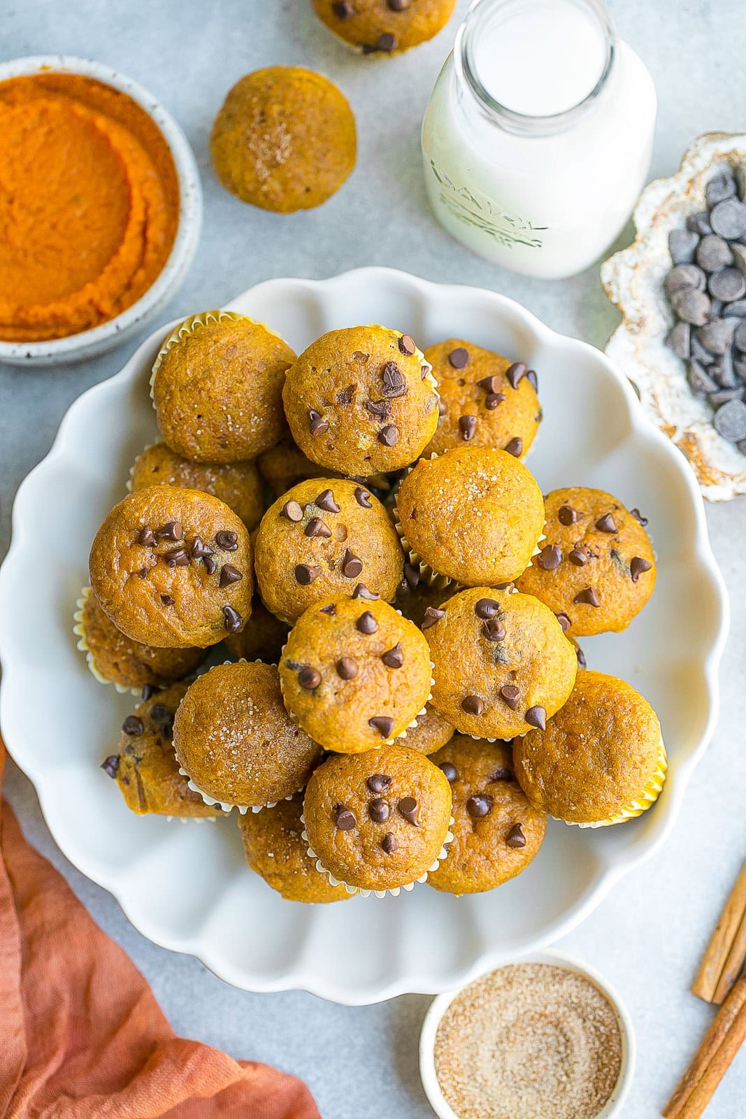 White bowl full of Mini Pumpkin Muffins.