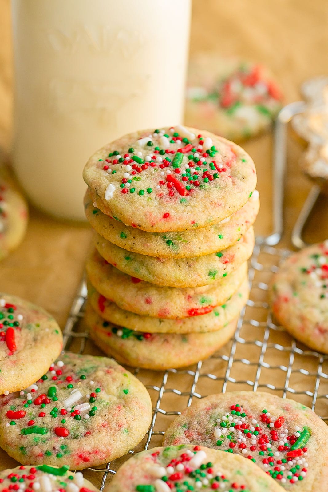 Stack of mini sugar cookies with sprinkles.