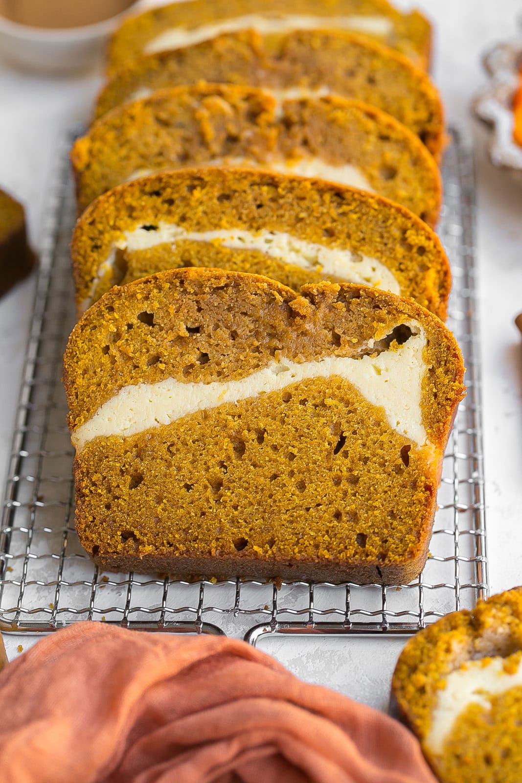 Pumpkin cream cheese bread placed on a cooling rack. 