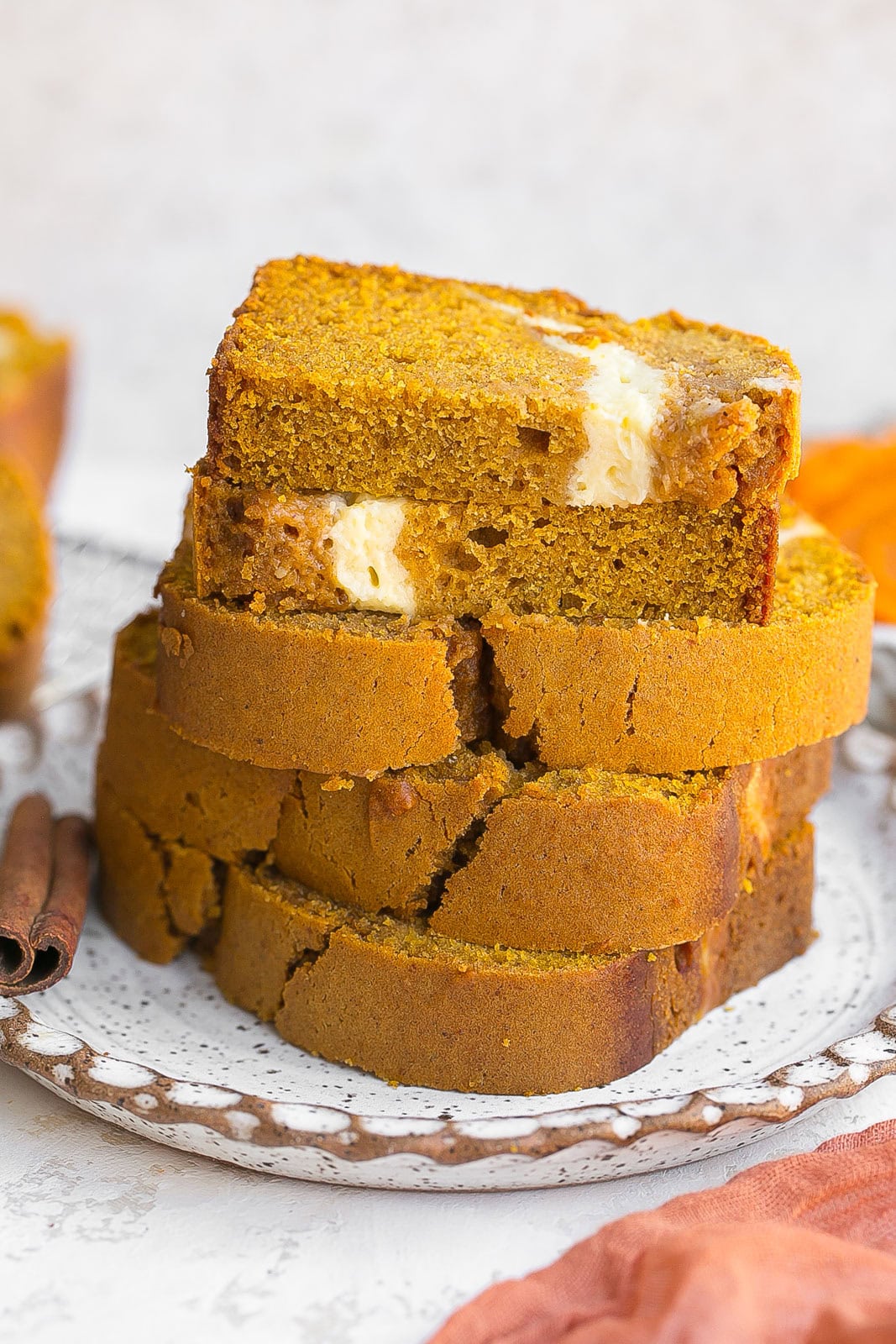 Stack of pumpkin bread with cream cheese swirls. 