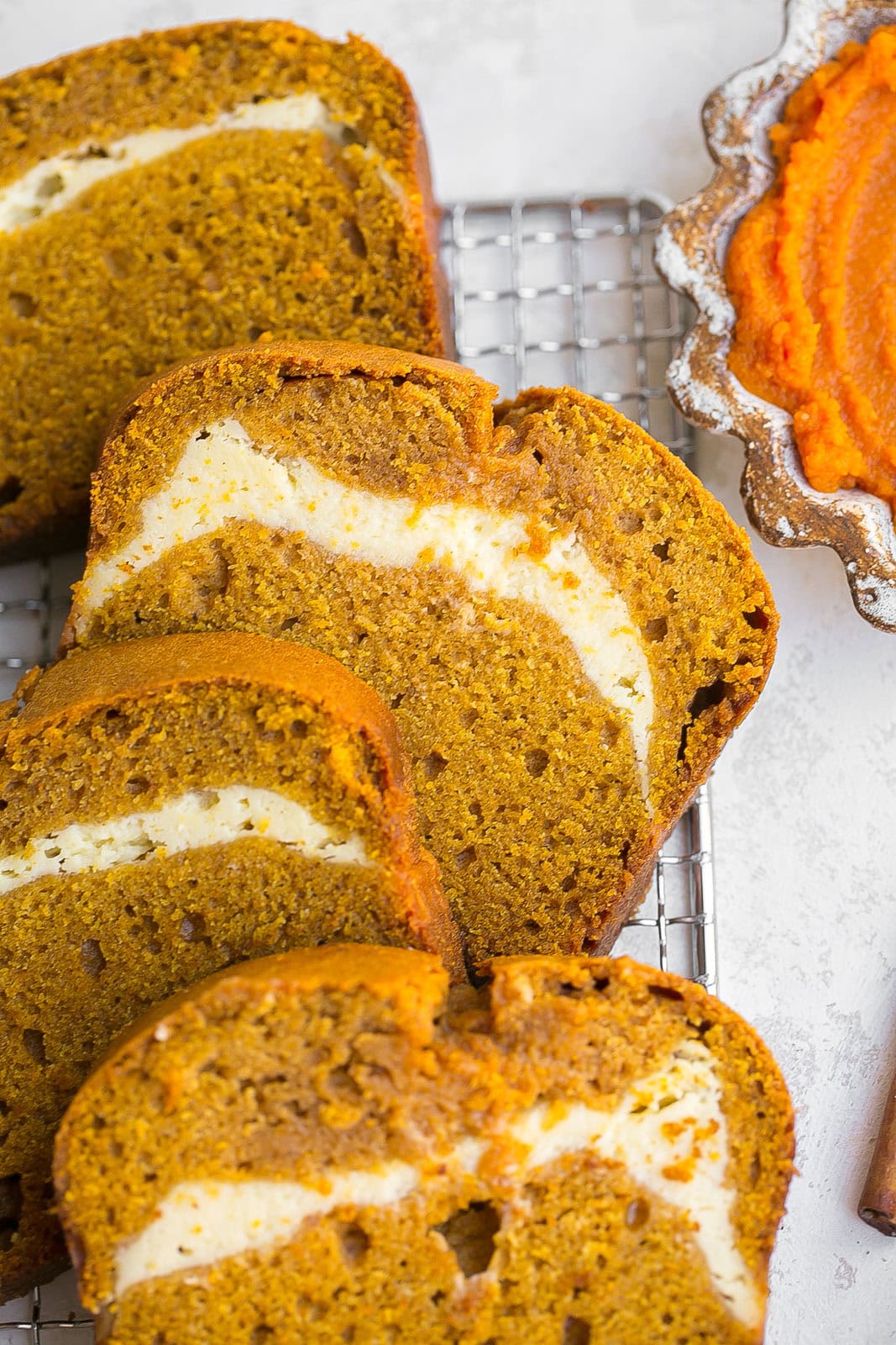 Sliced pumpkin cream cheese bread. 