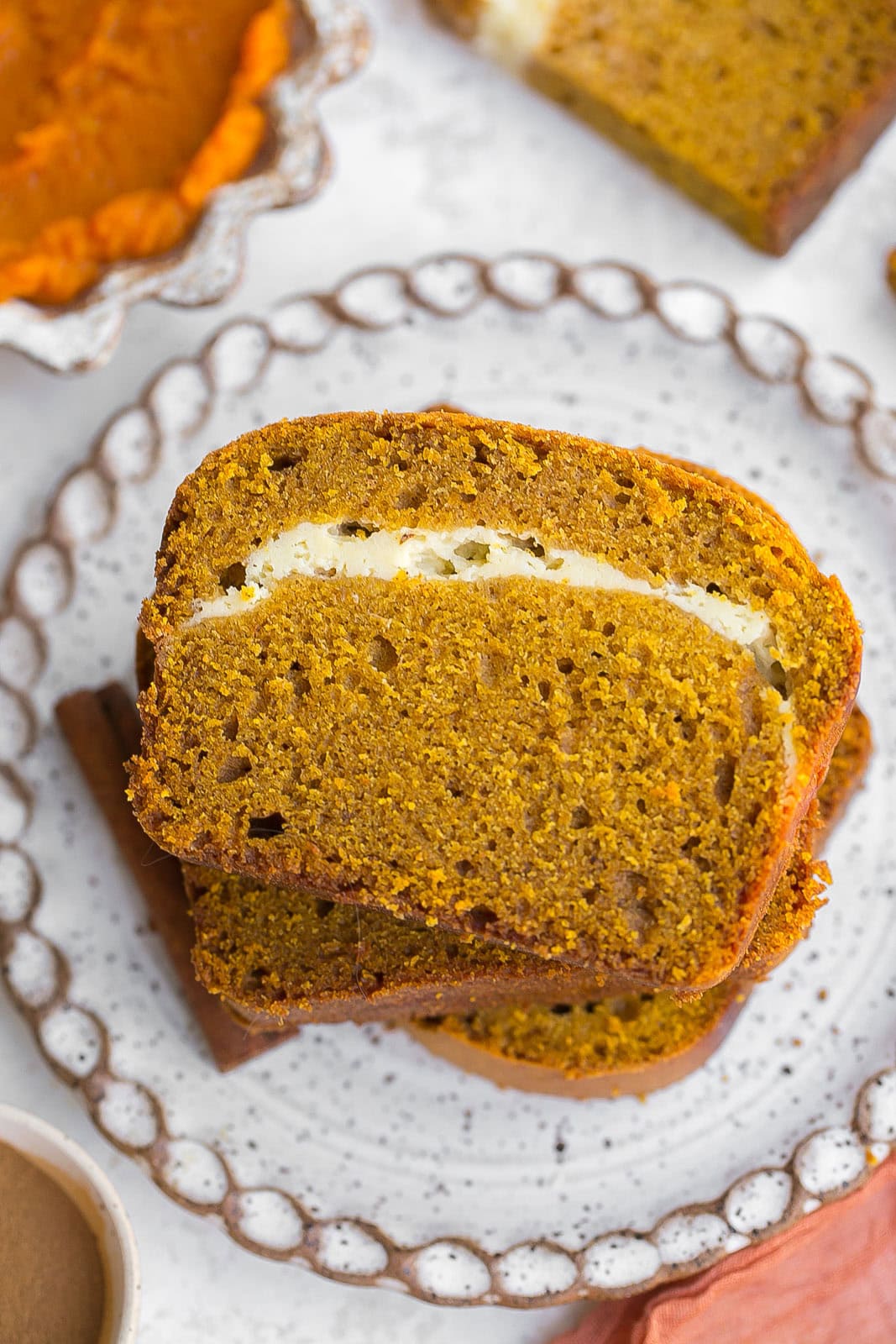 Birds eye view of a few slices of pumpkin swirl bread. 