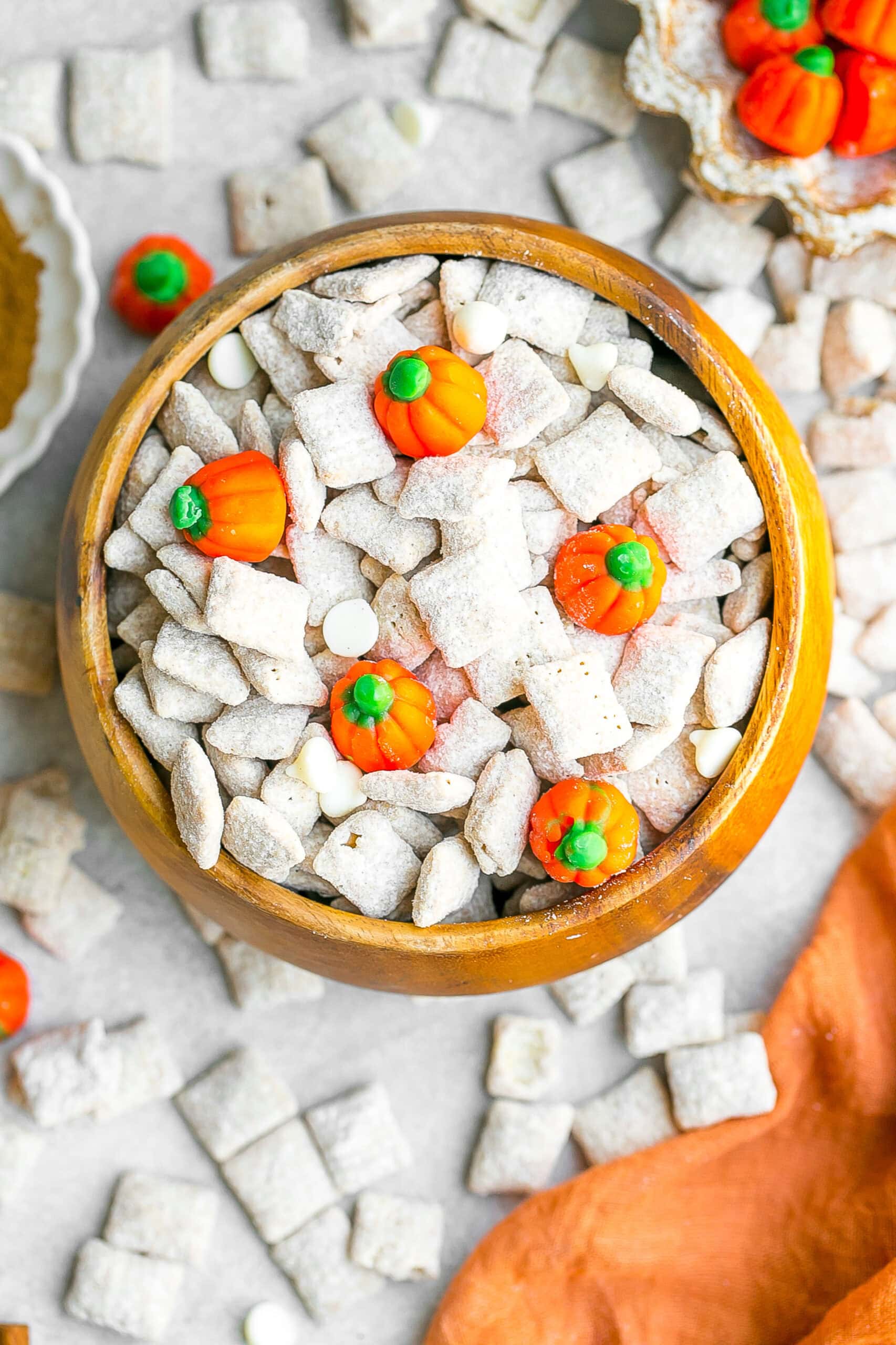 Pumpkin Spice Muddy Buddies in a wooden bowl.