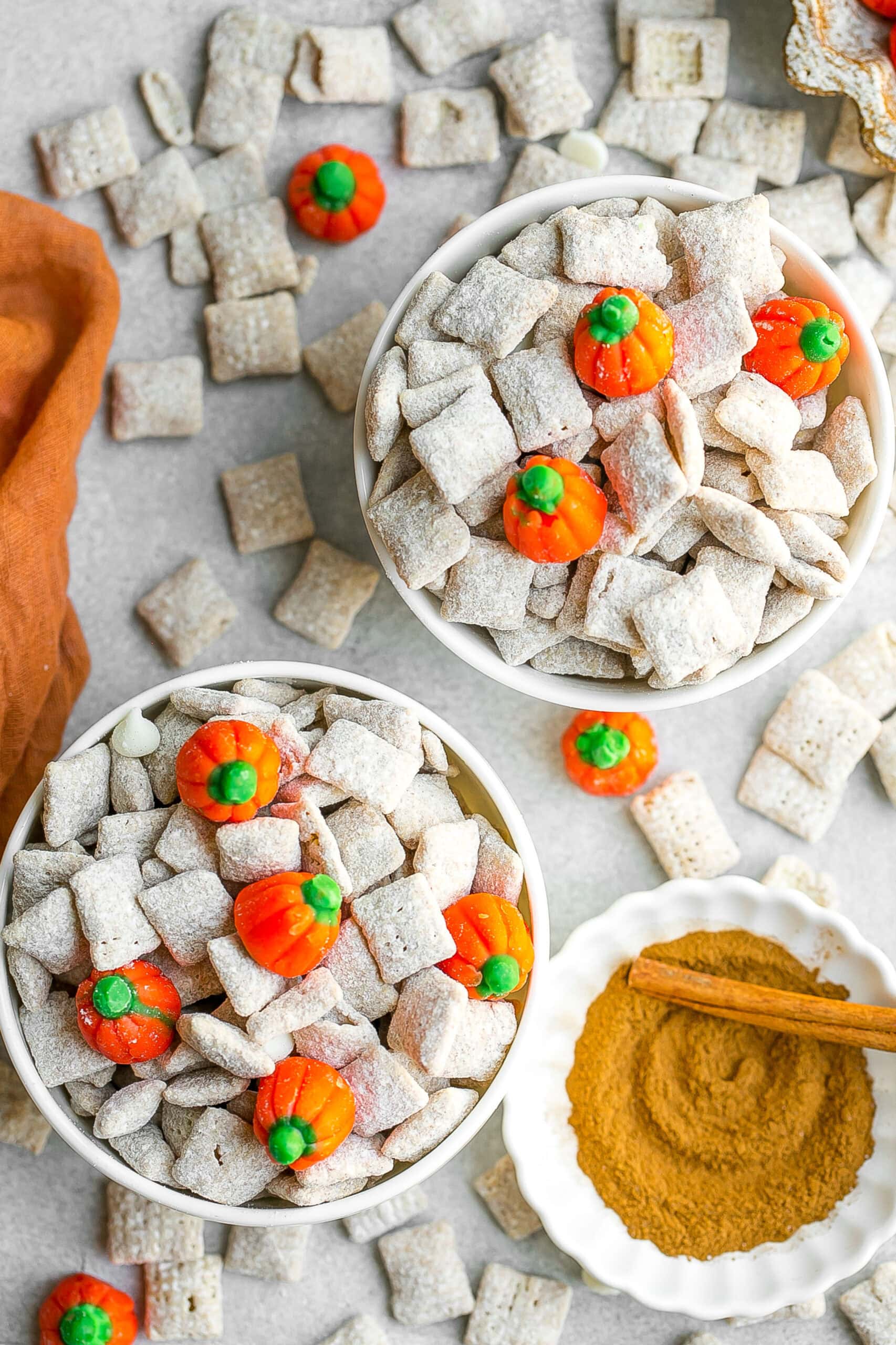 Pumpkin spiced puppy chow in two white bowls.