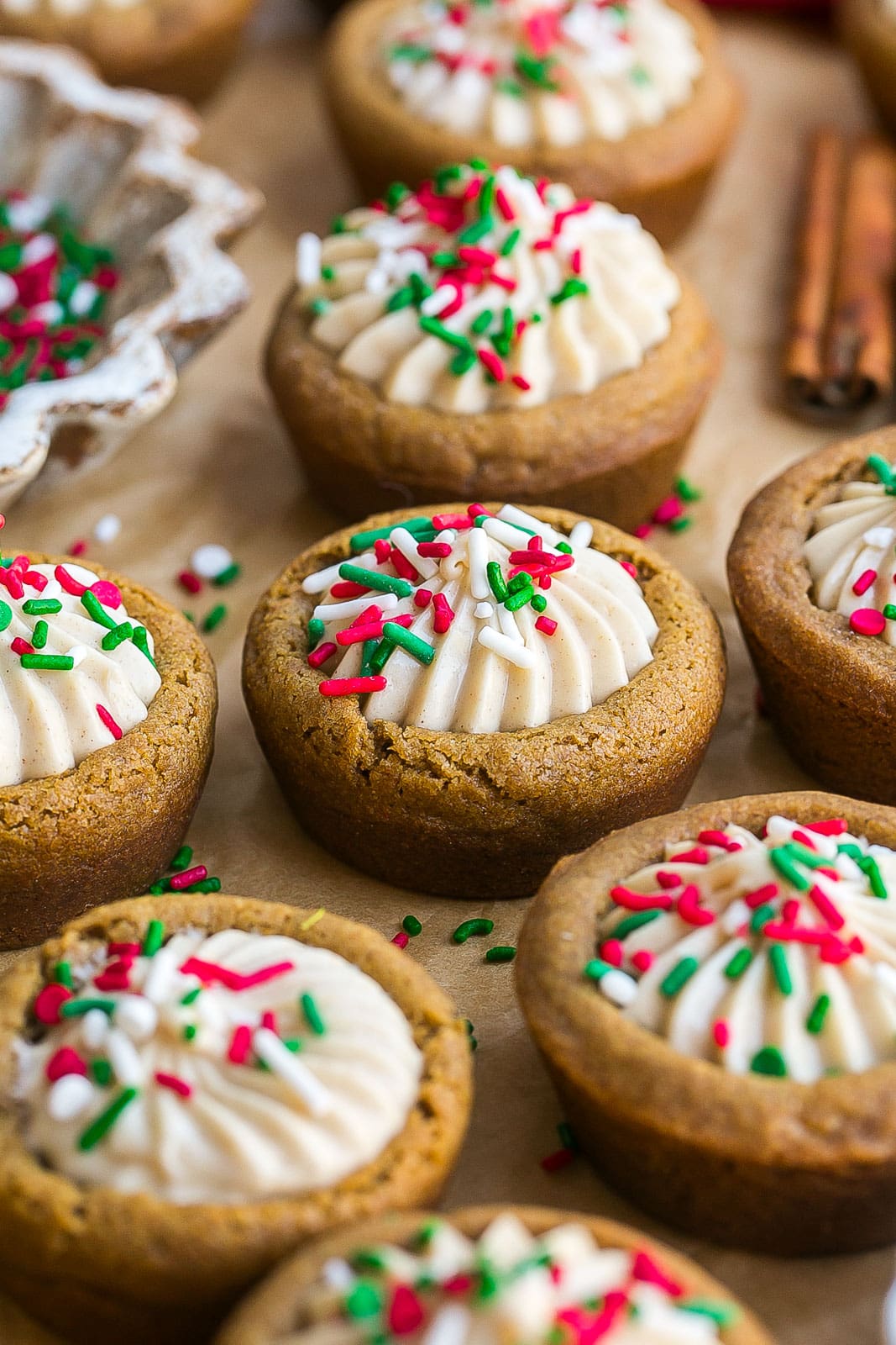 Gingerbread cookie cups on parchment paper.