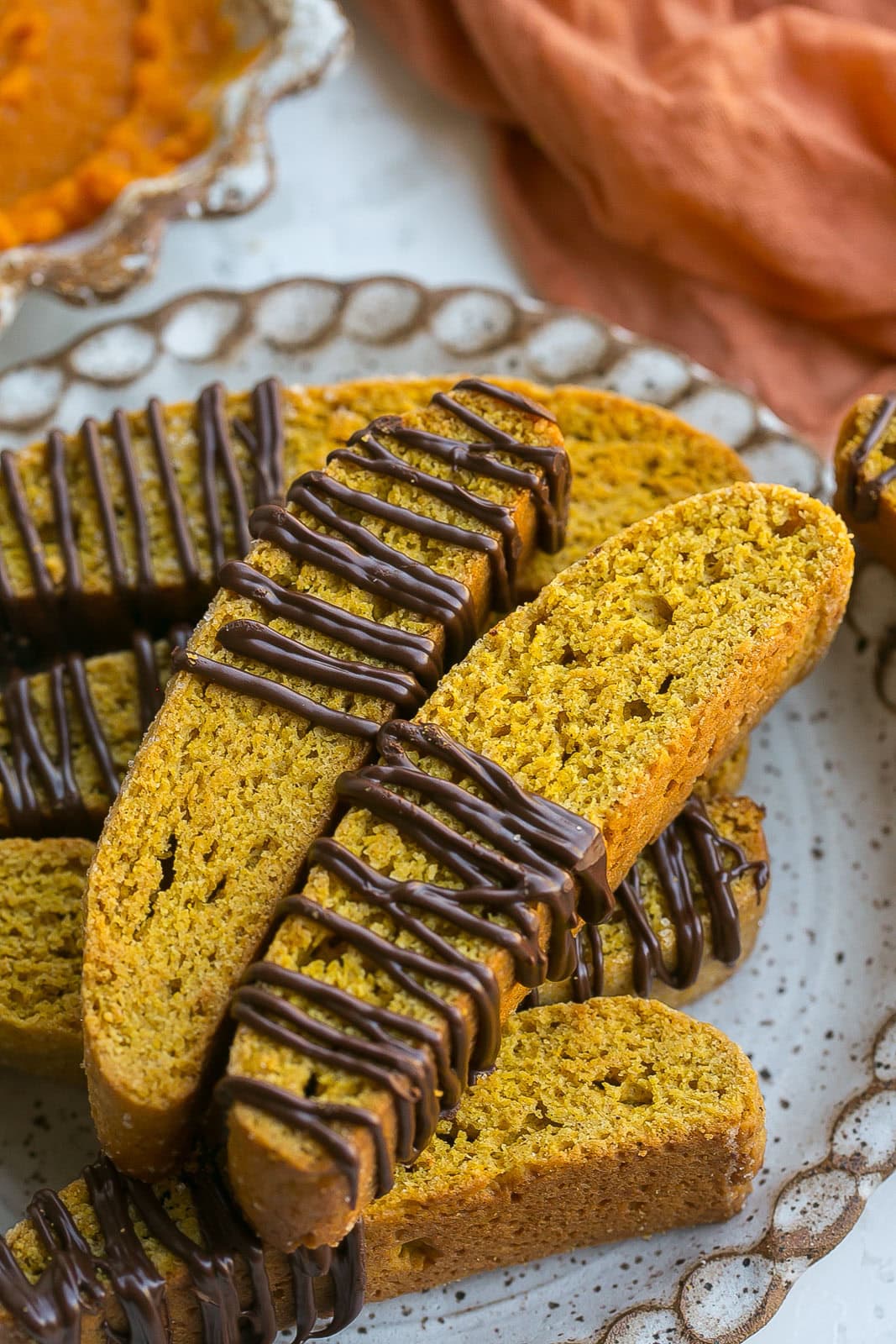 Close up of chocolate on Pumpkin Biscotti cookies.