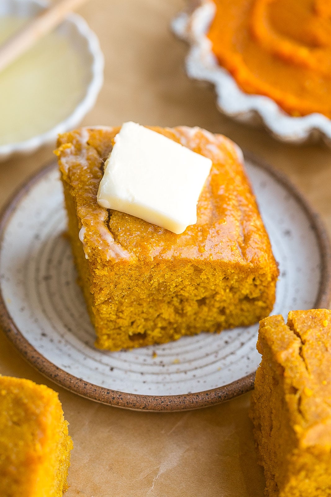 Pat of butter on pumpkin cornbread.