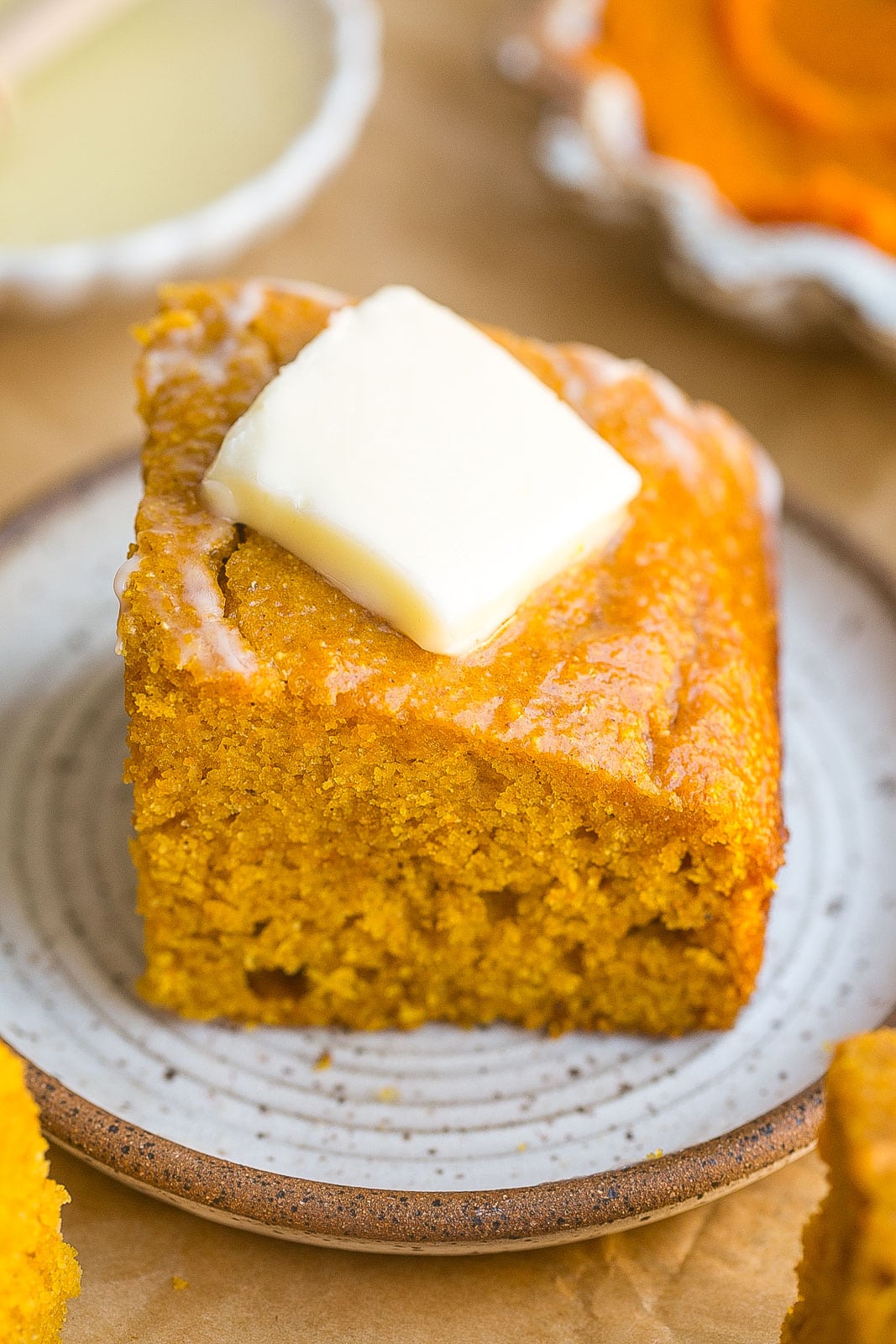 Pumpkin cornbread with butter.