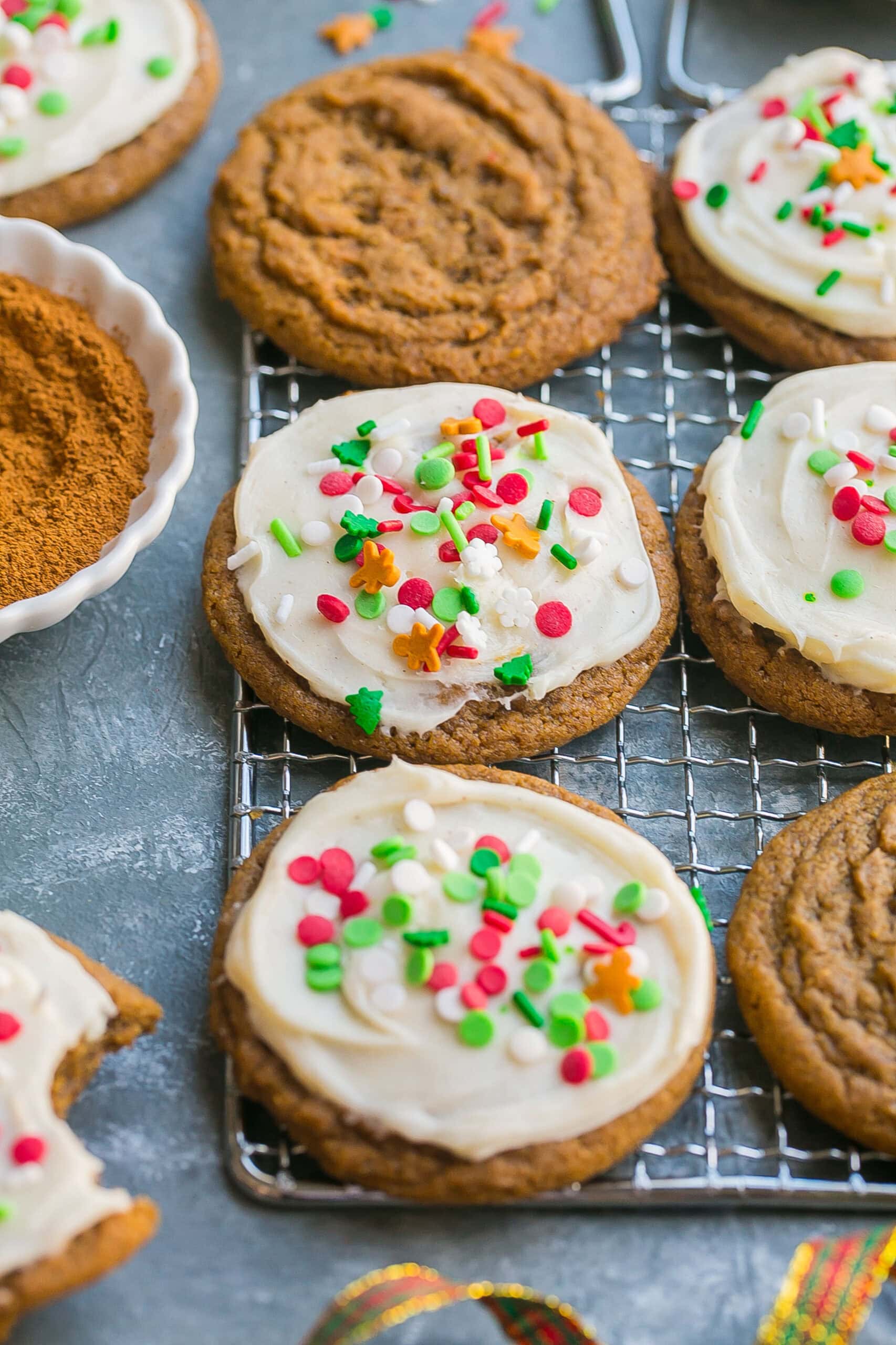 Gingerbread sugar cookies on cooling rack.