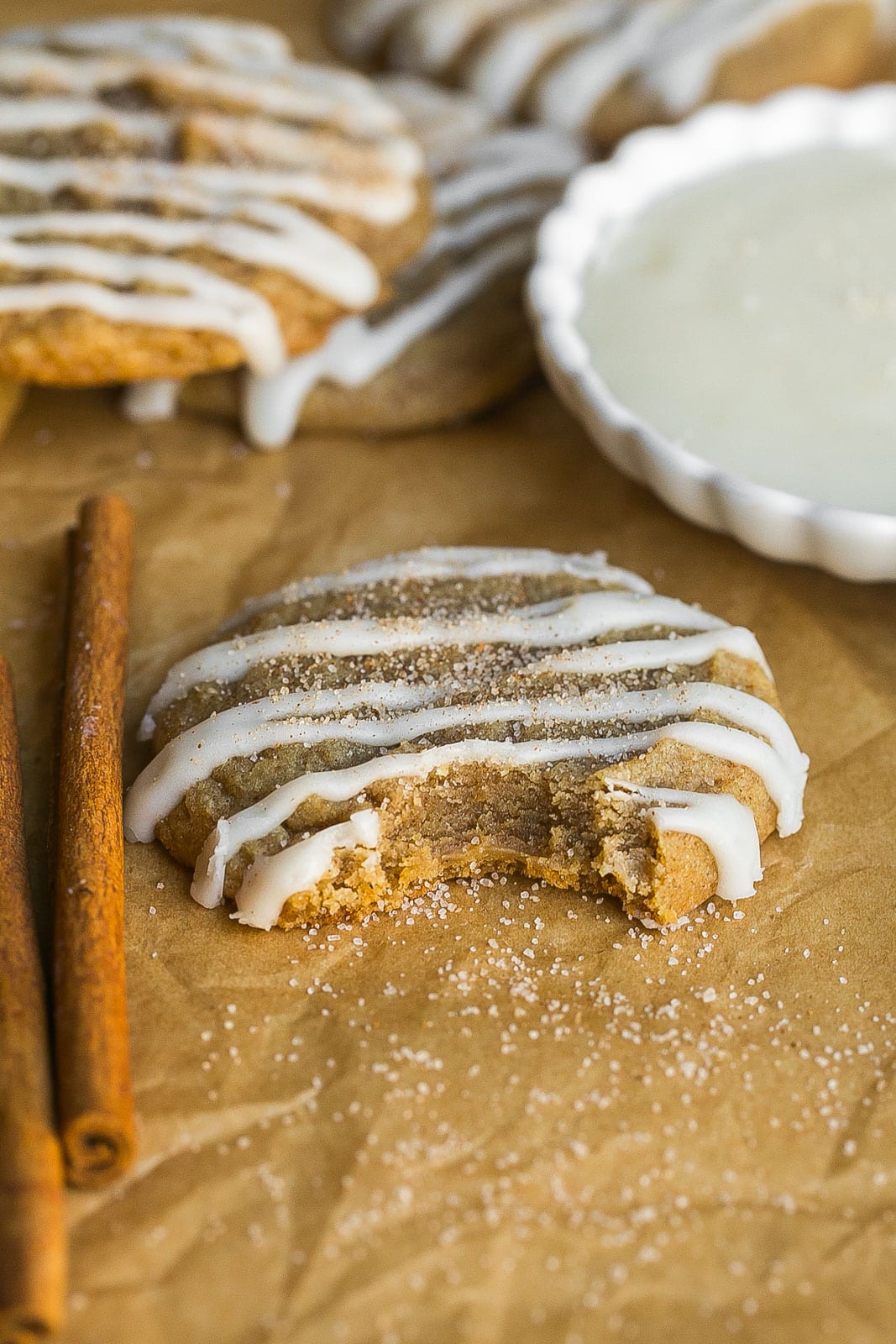 Bite mark in a cinnamon roll sugar cookie.