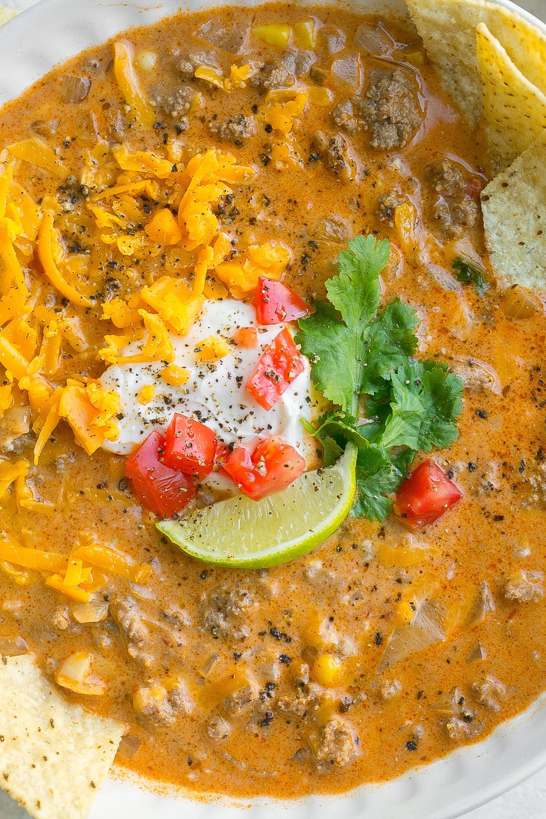 Close up of cheesy enchilada soup.