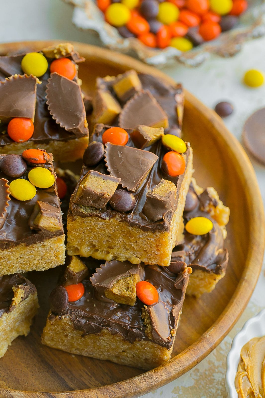 Chocolate Peanut Butter Rice Krispie Treats stacked on a plate.