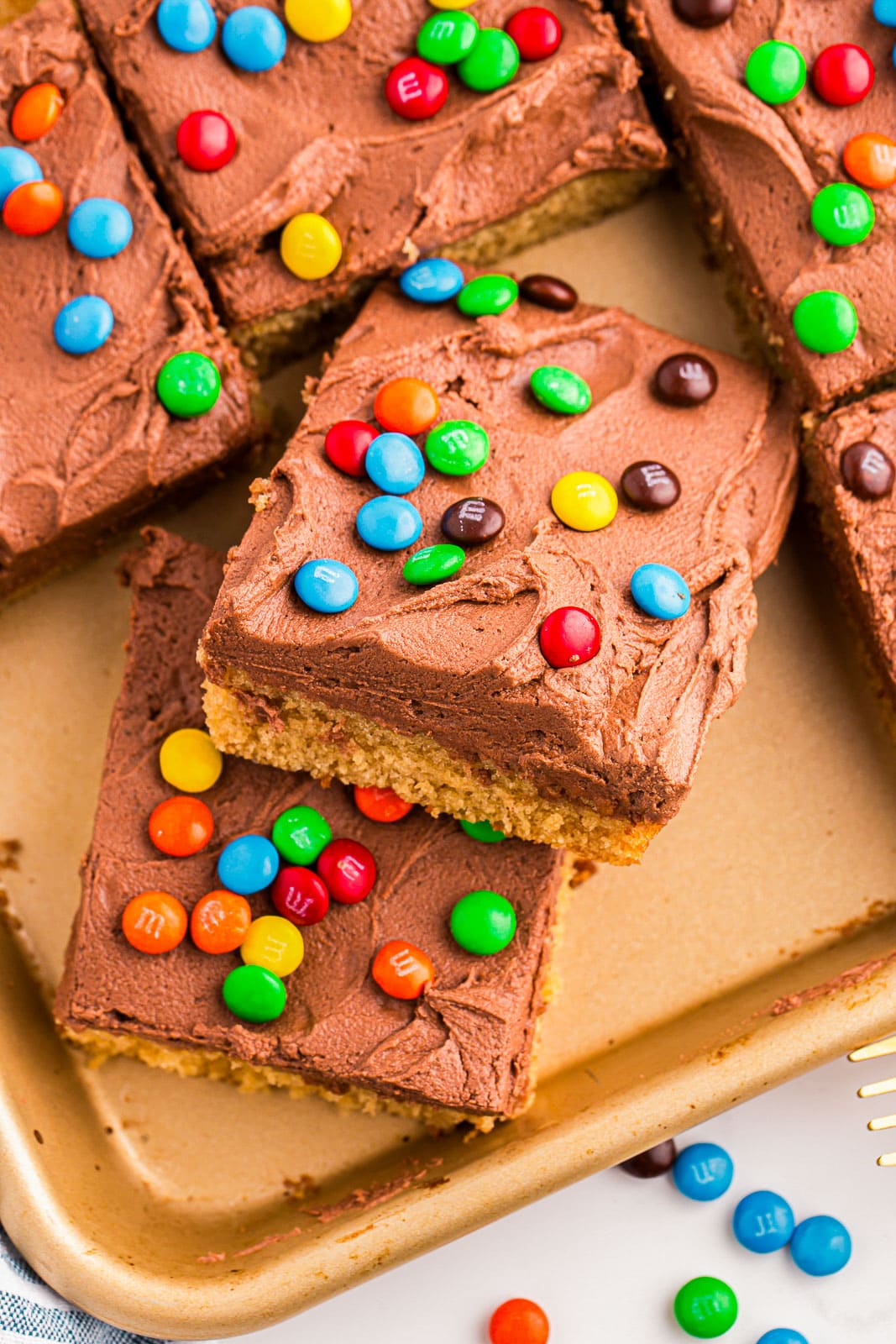 Peanut butter cake with creamy peanut butter chocolate frosting and M&Ms.