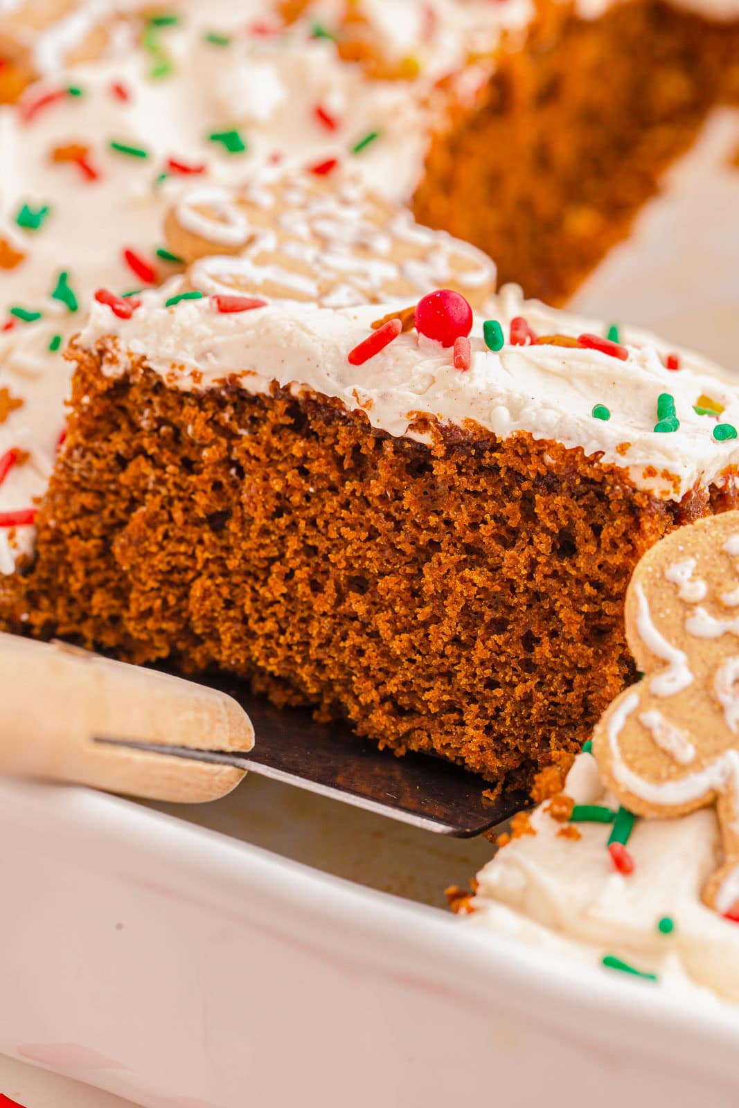 Piece of a frosted gingerbread sheet cake.