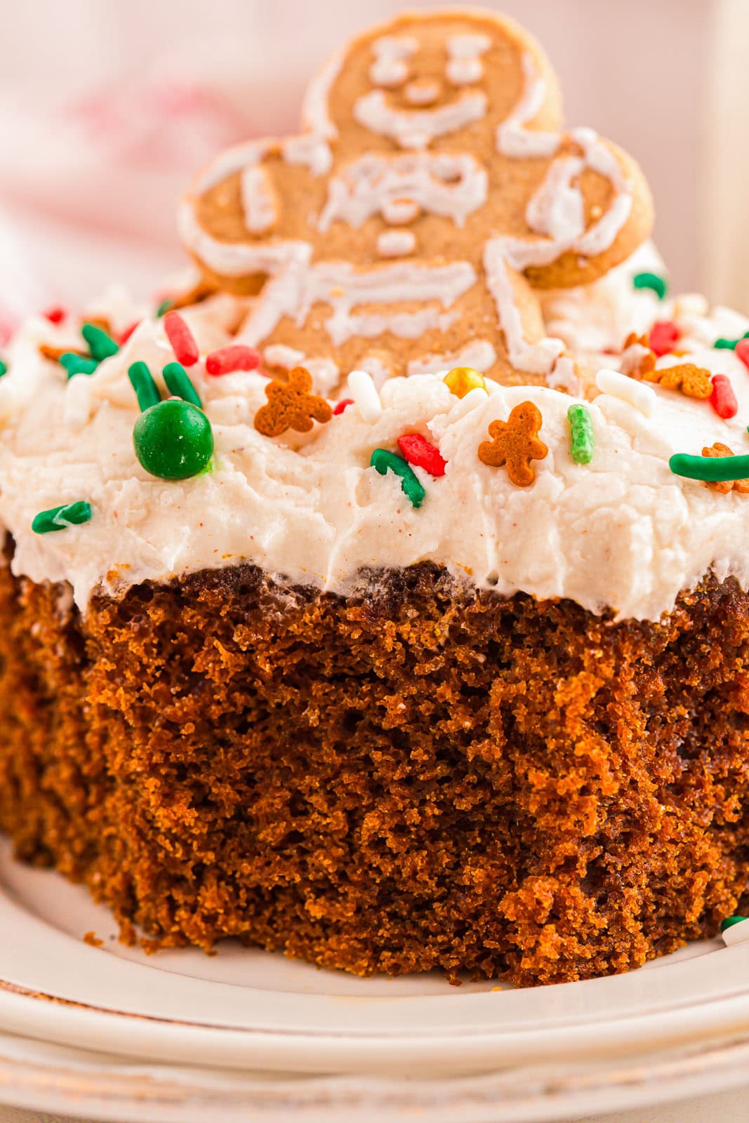 Close up of gingerbread cake with cream cheese frosting.