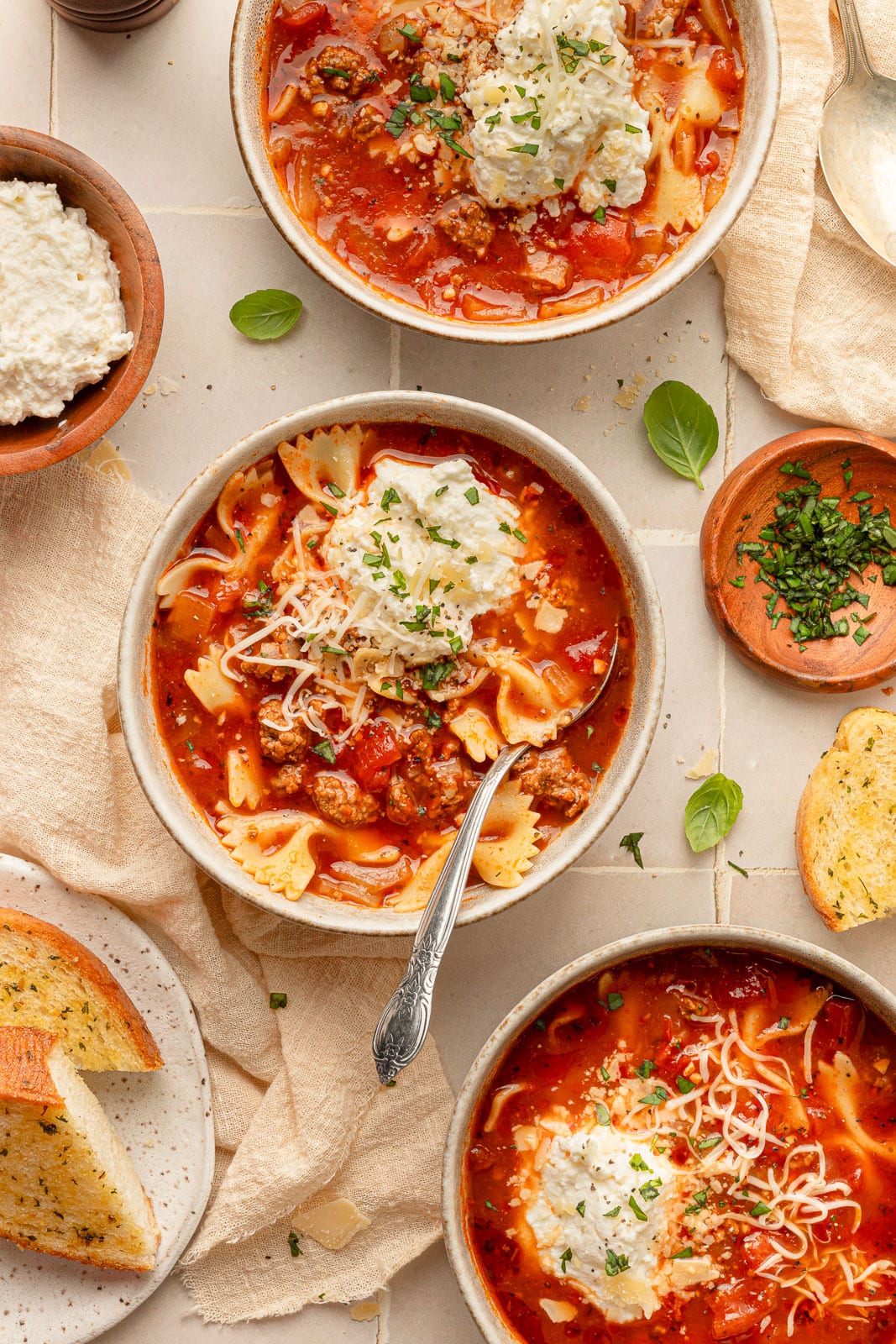 Lazy lasagna soup with ricotta cheese on top. 