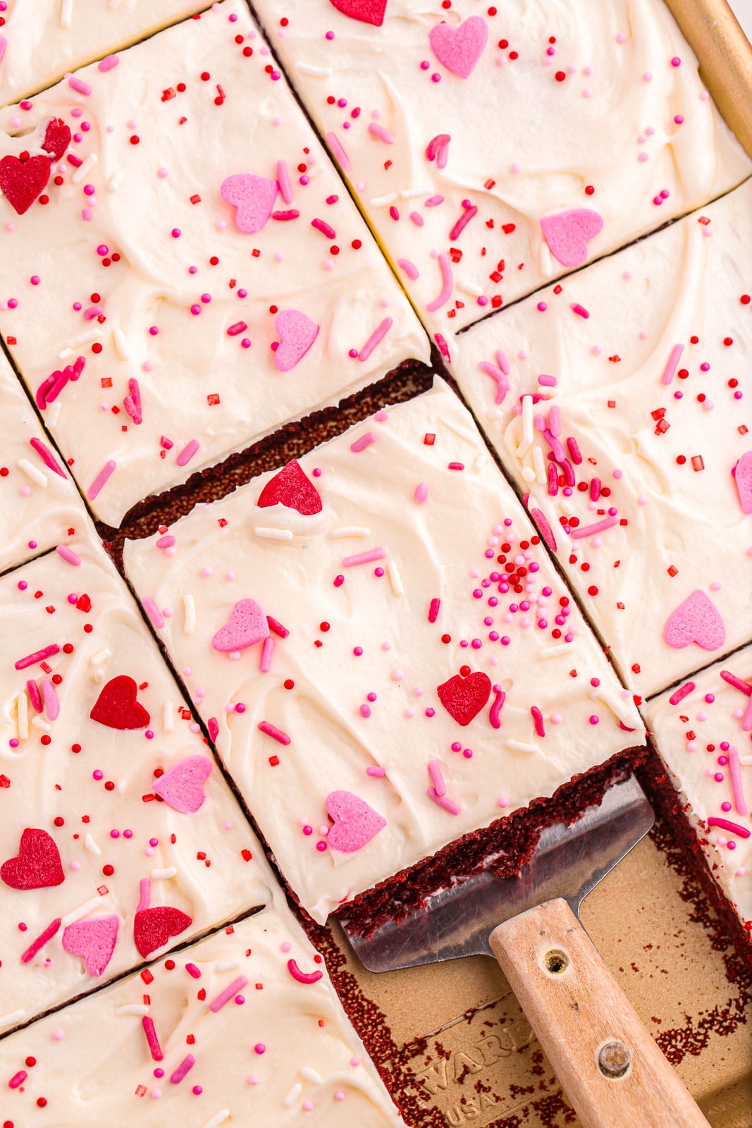 Slice of frosted Valentine's day cake.