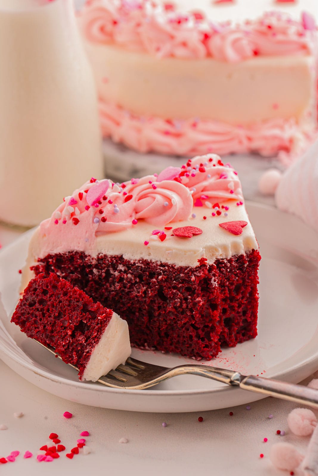 Slice of Heart Shaped Cake with frosting.