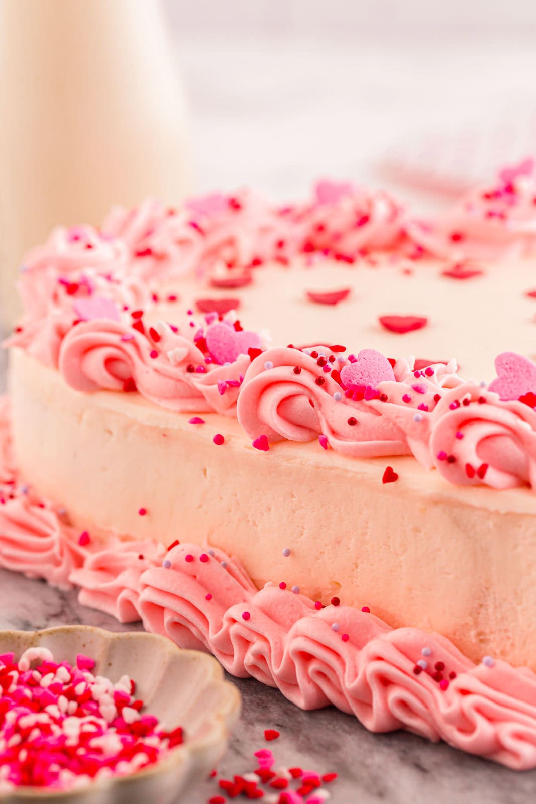 Side view of a decorated heart cake.