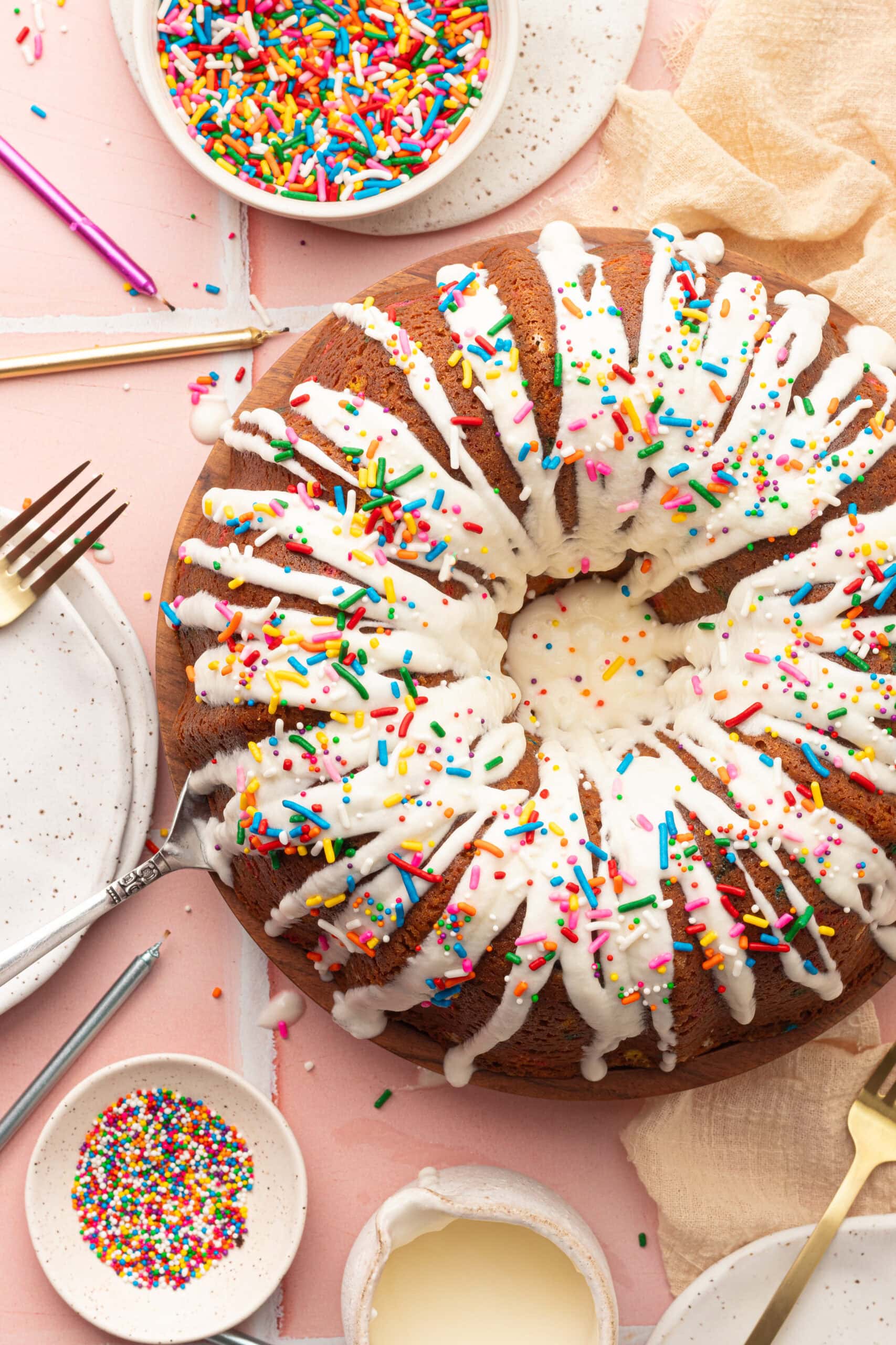 Frosted Funfetti Bundt Cake with rainbow sprinkles.