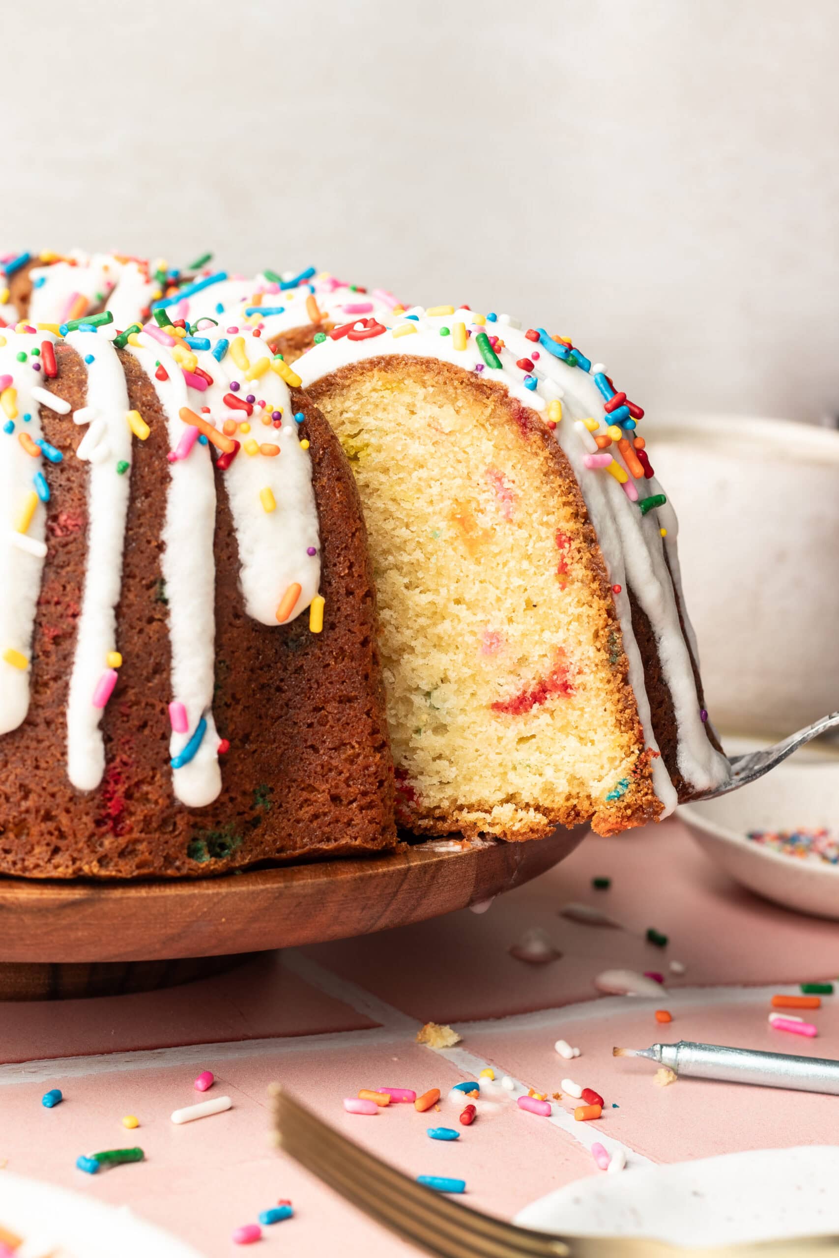 Pulling a slice of homemade funfetti cake.