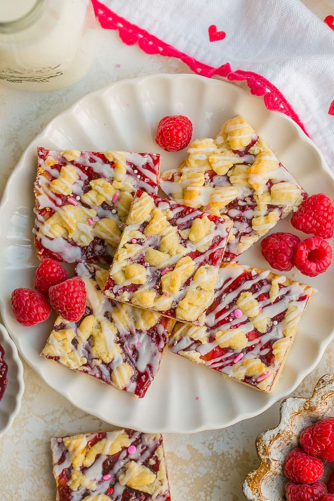 Jam bars with raspberries on a plate. 