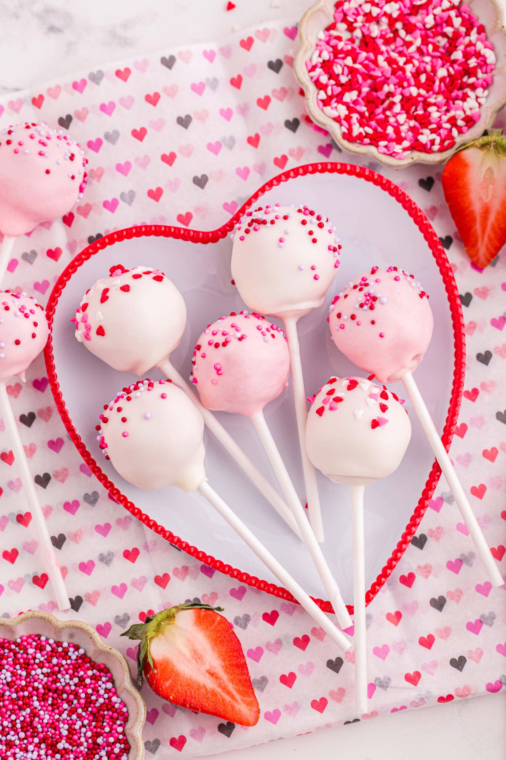 Strawberry Cake Pops on a heart plate.