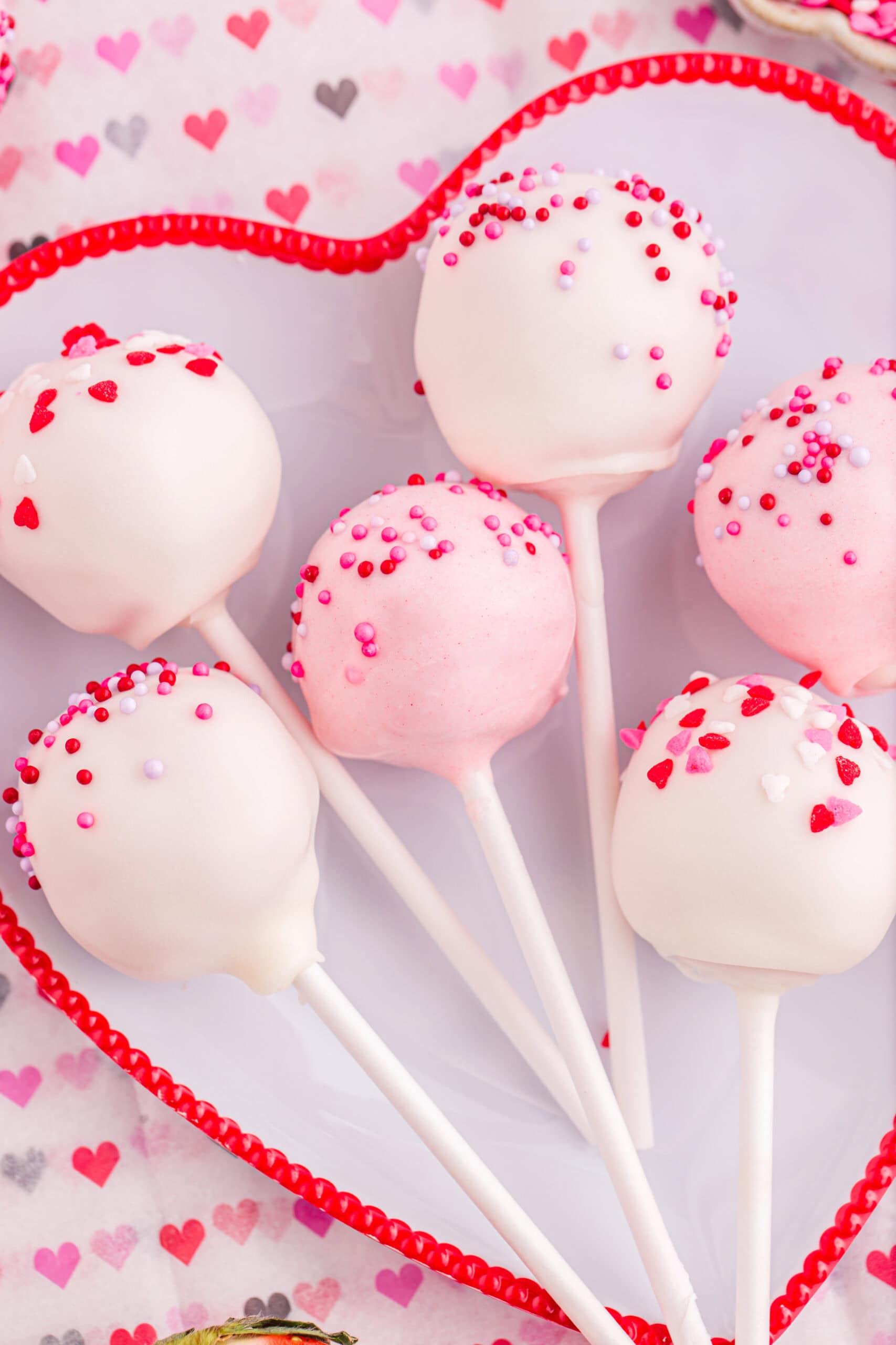 Close up of white chocolate coated cake pops.