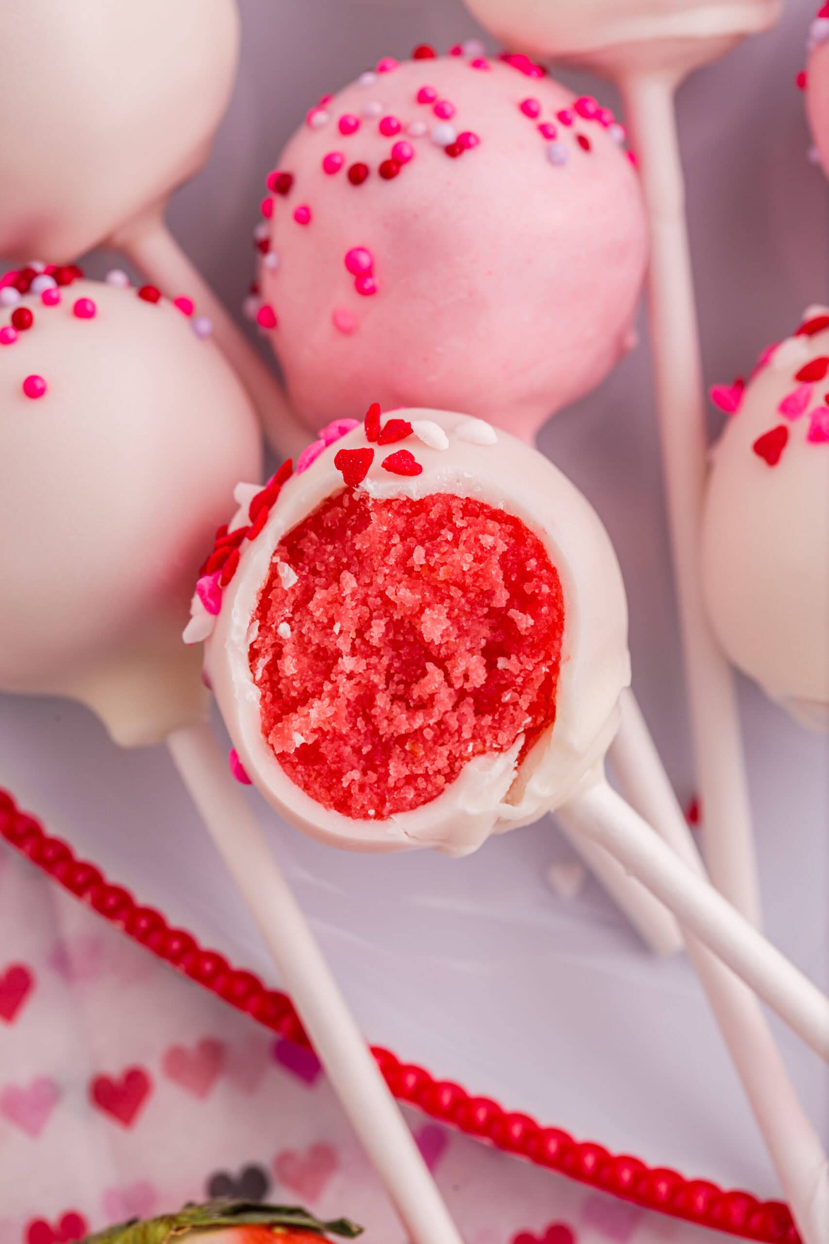 Valentine's Day cake pops with bite in the center.