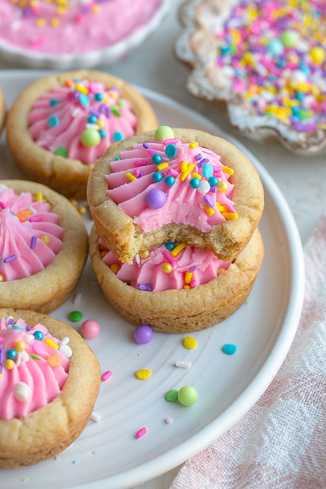 Stack of cookie cups with bite mark. 