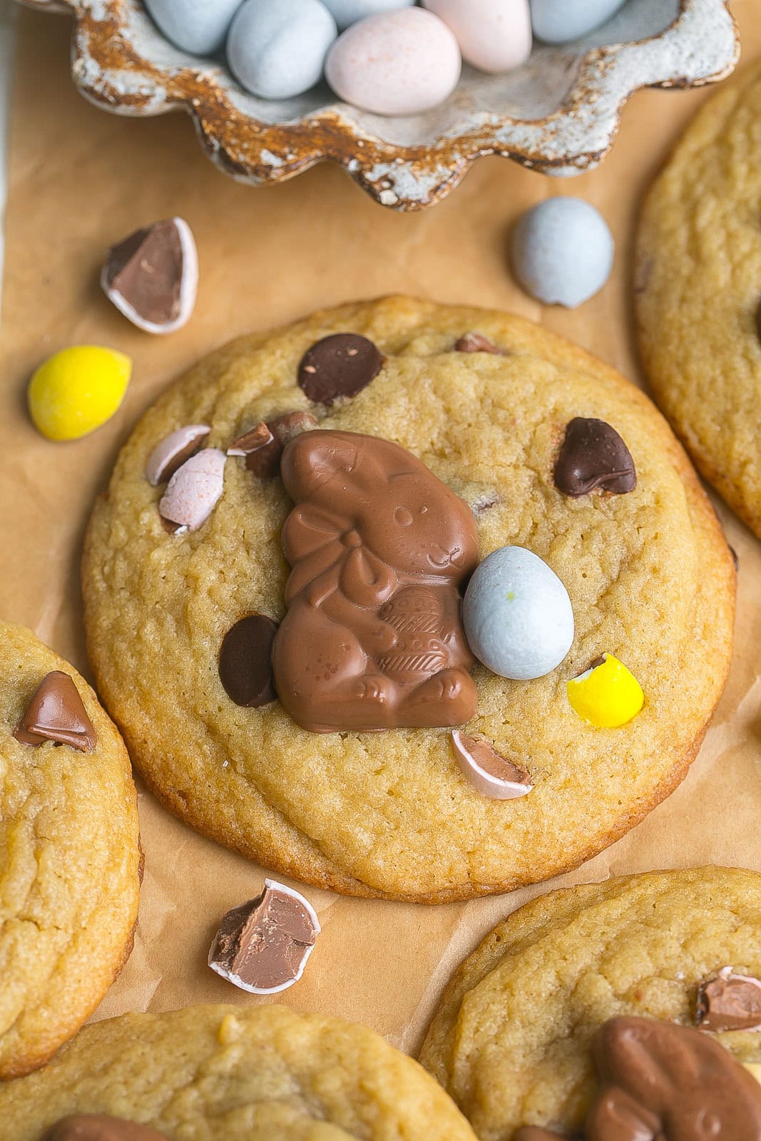 Chocolate chip cookie with Cadbury Mini Eggs and chocolate bunny on top.