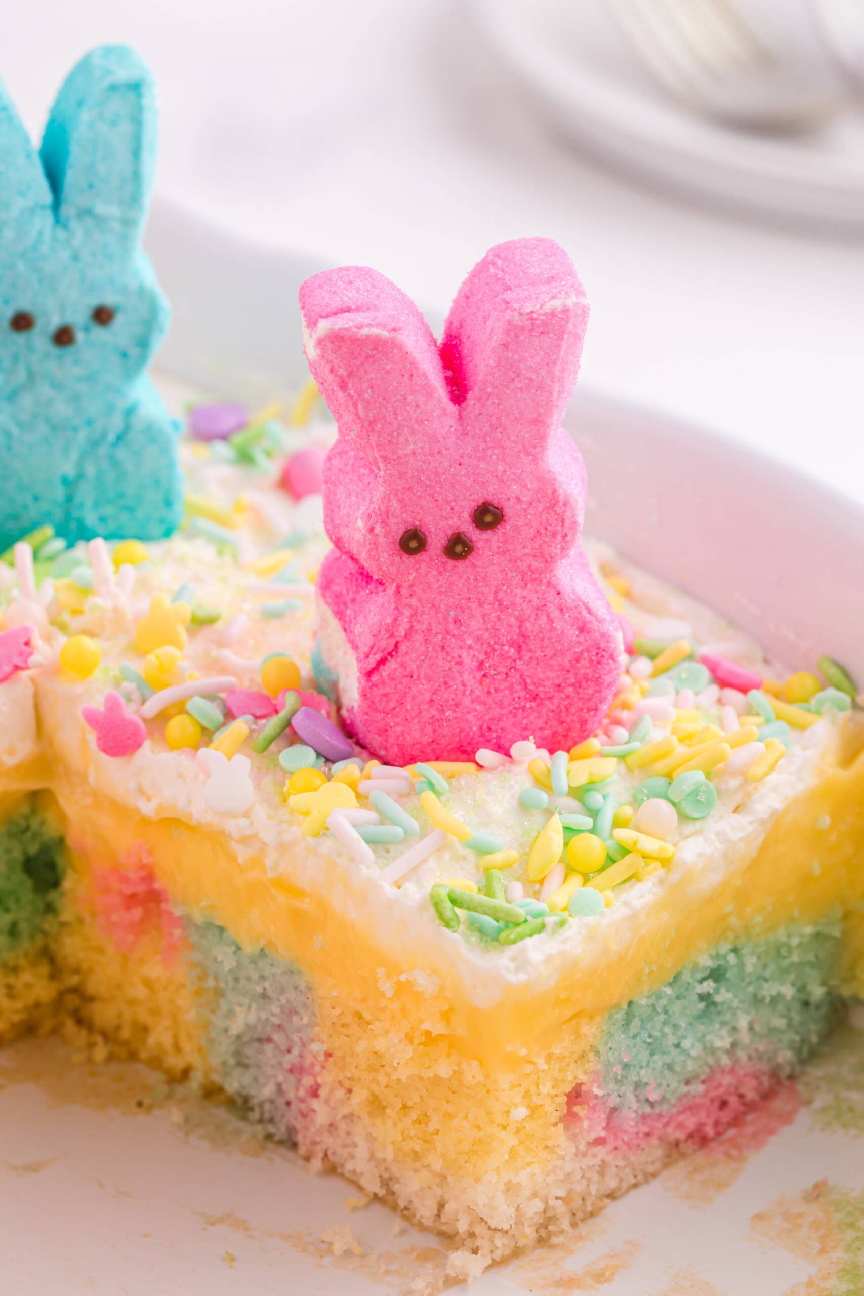 Poke cake with pink marshmallow bunny Peep on top.