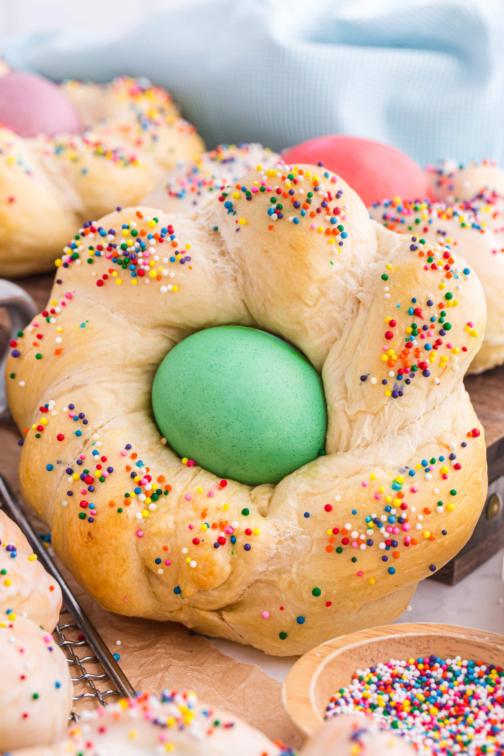 Easter bread with dyed egg in the middle.