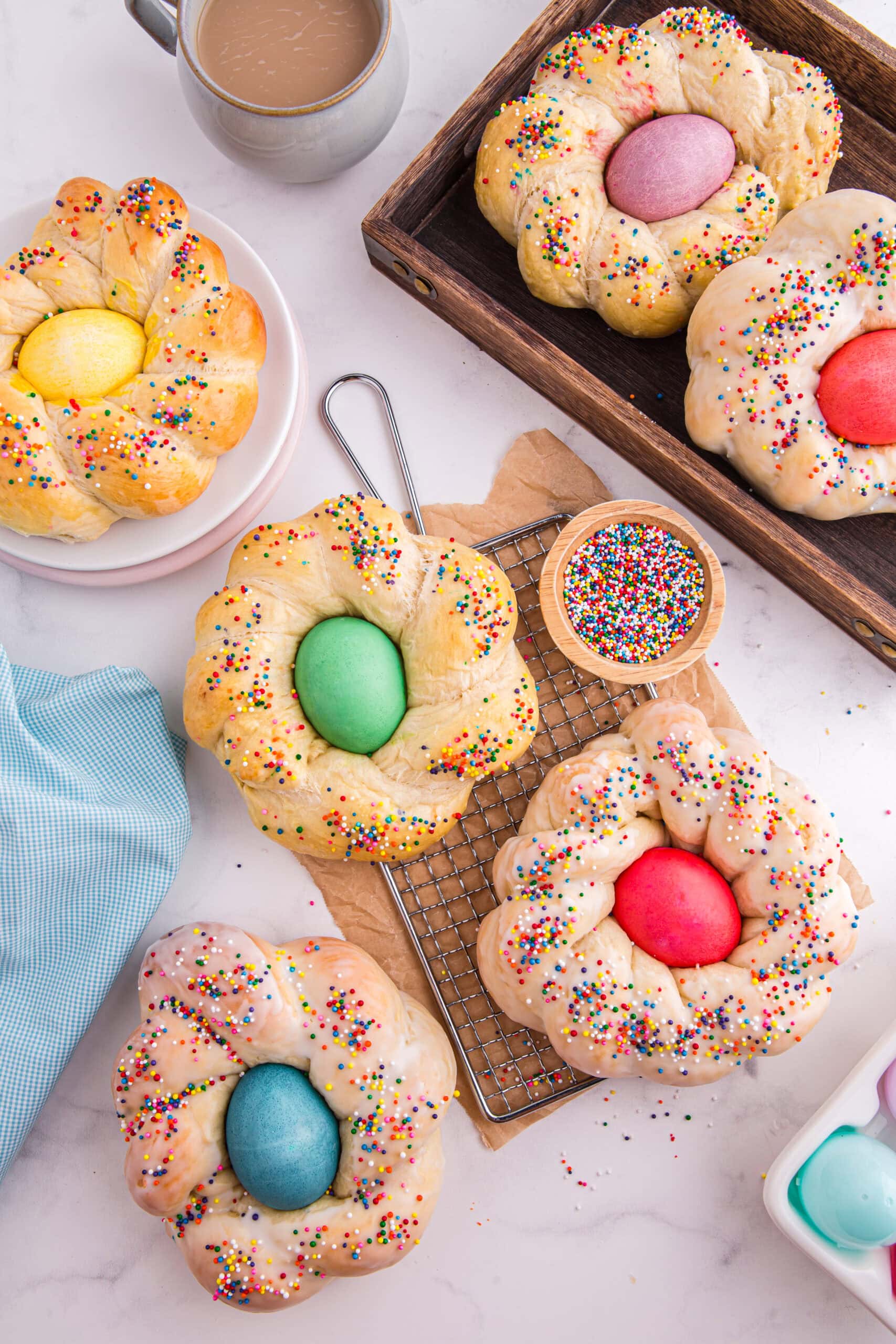 Braided Easter bread with sprinkles and dyed eggs.