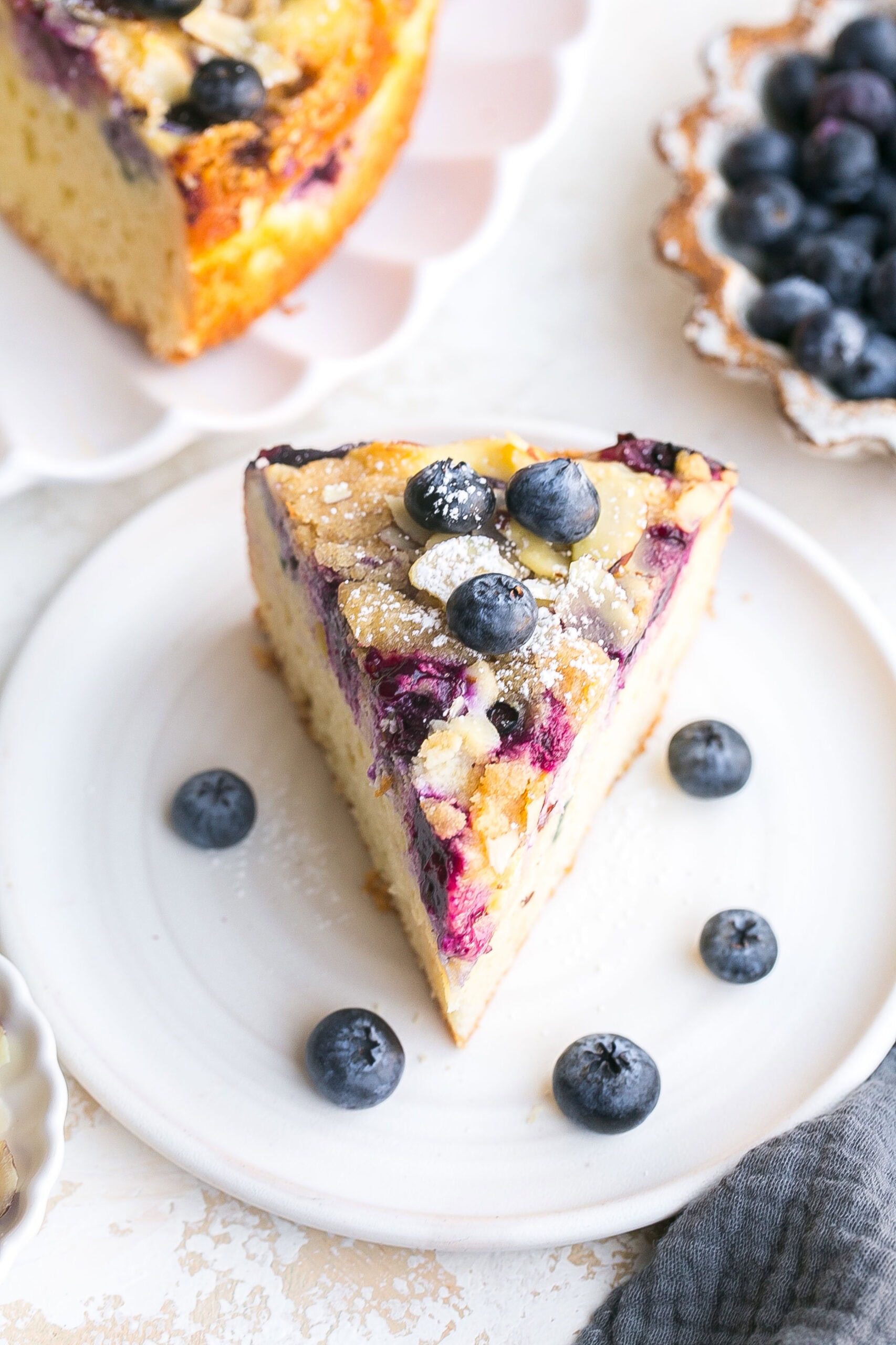 The perfect slice of coffee cake with blueberries.