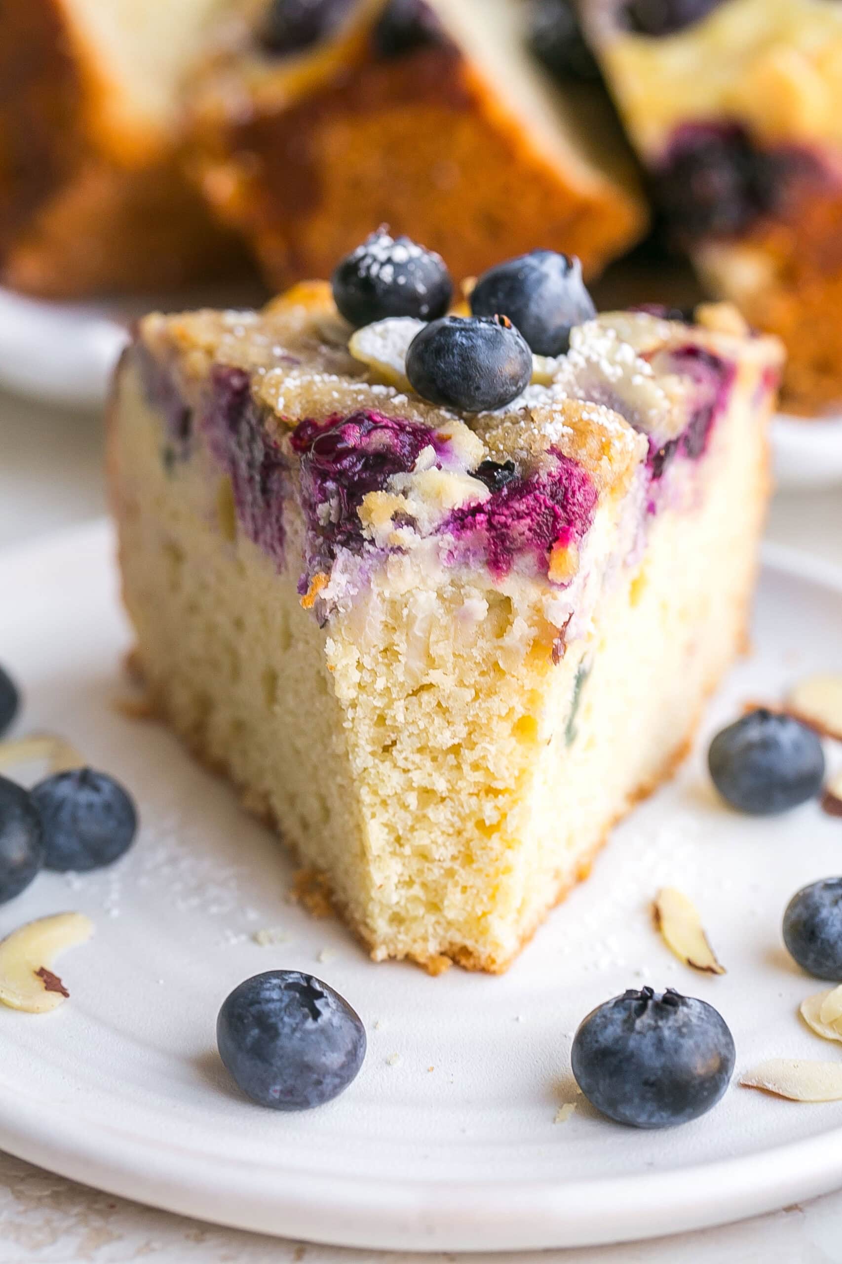 Bite inside a slide of Blueberry Cream Cheese Coffee Cake.