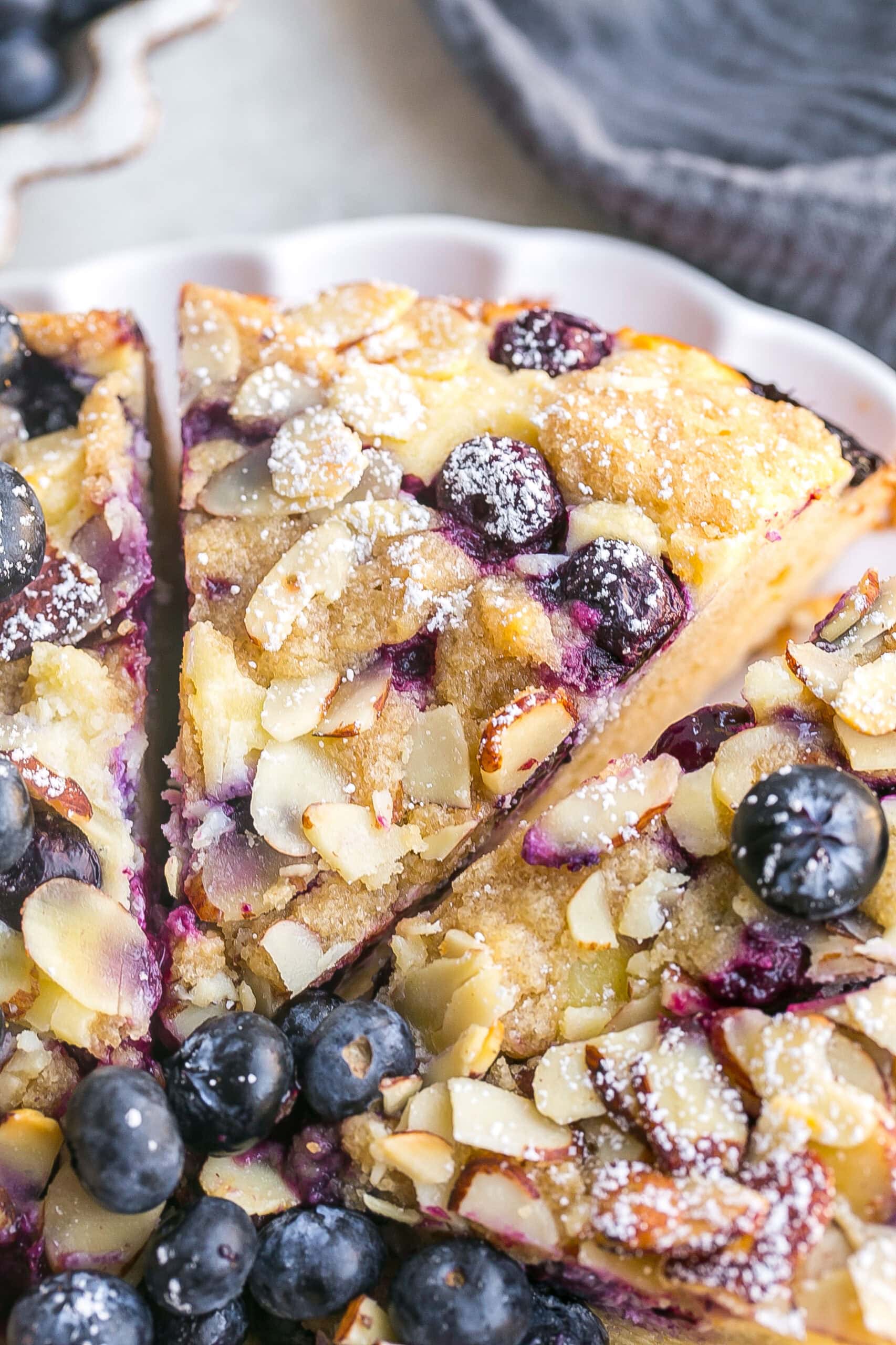 Slice of coffee cake with blueberries.