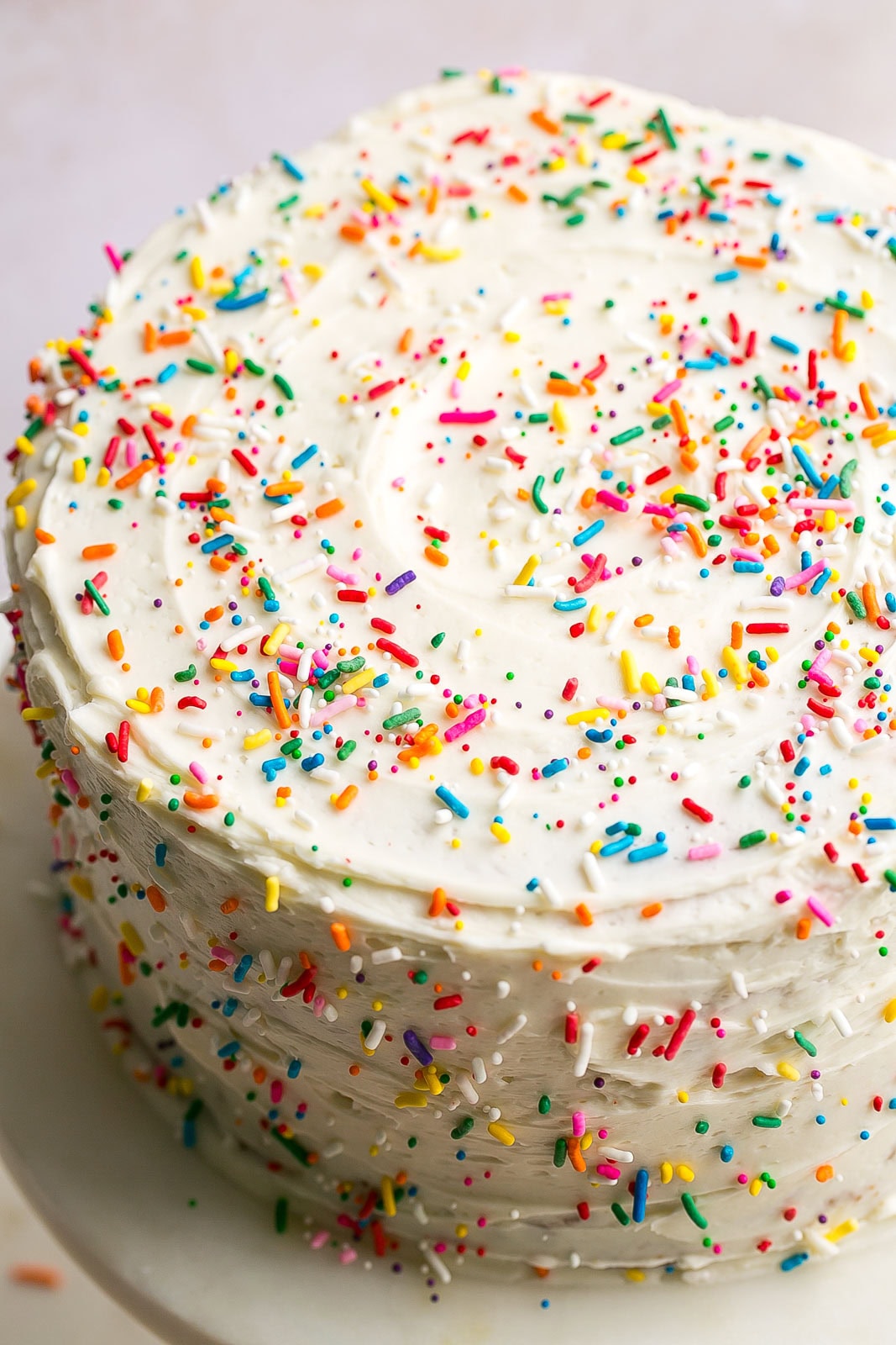 Frosted and sprinkled Vanilla Buttermilk Cake.