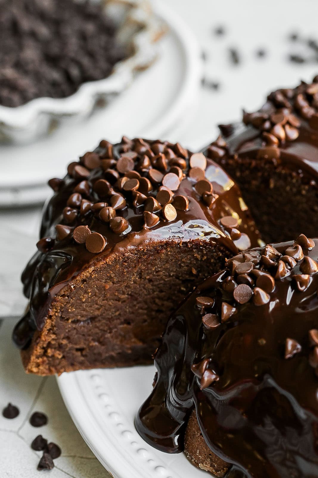 Double Chocolate Bundt Cake slice with chocolate chips on top.