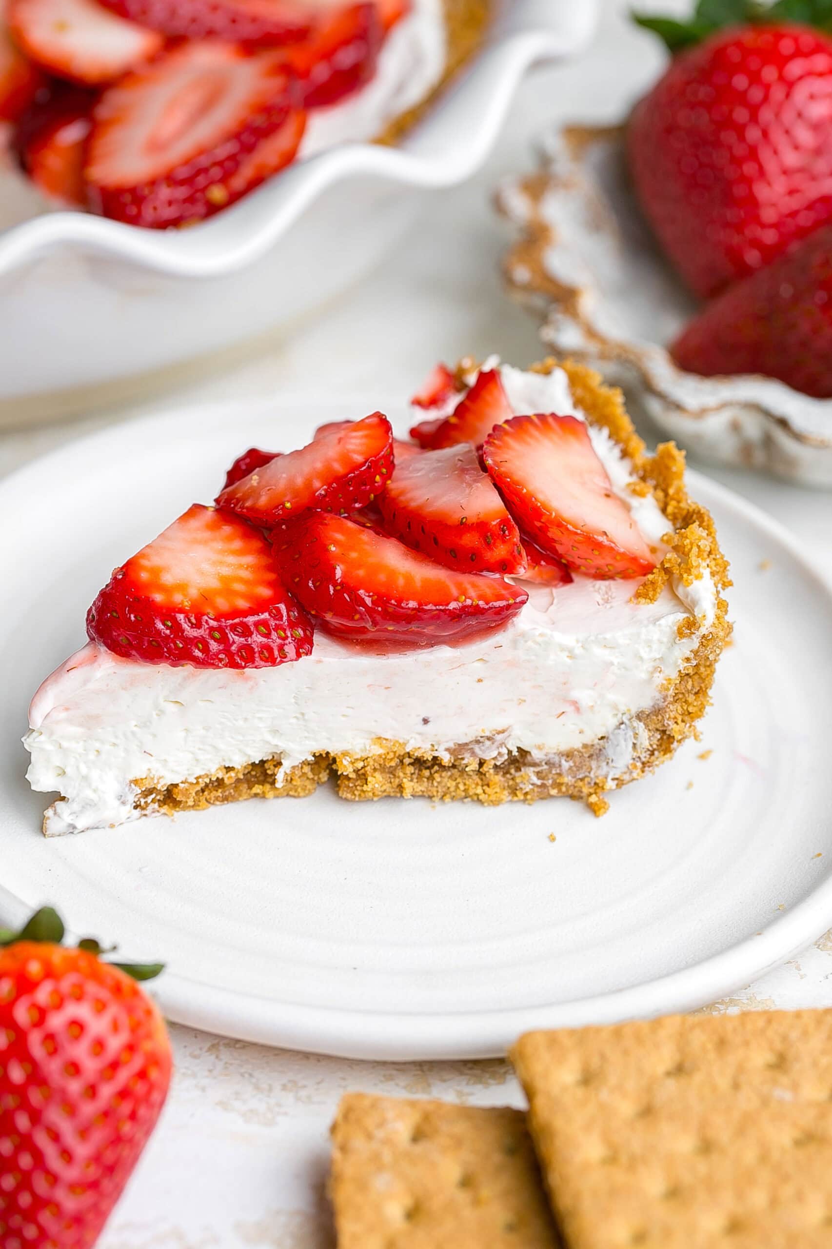 Side view of a perfect slice of Strawberry Cream Cheese Pie.