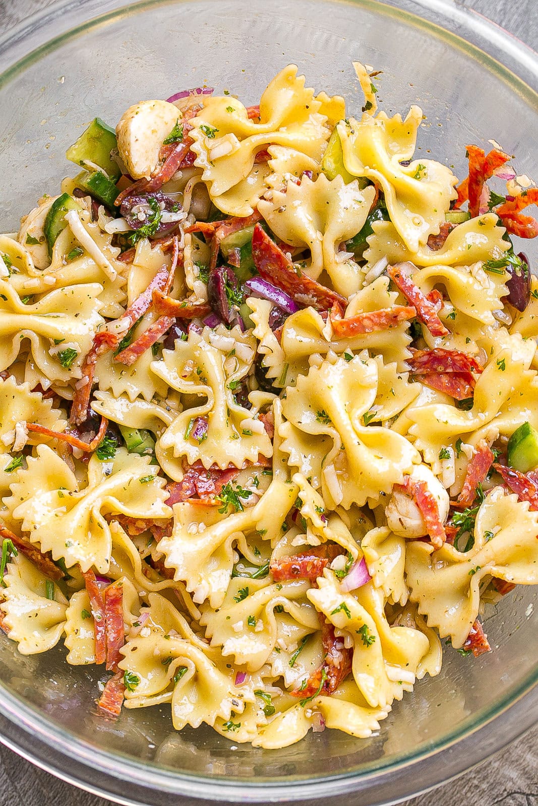 Close up of pasta salad in Italian dressing.