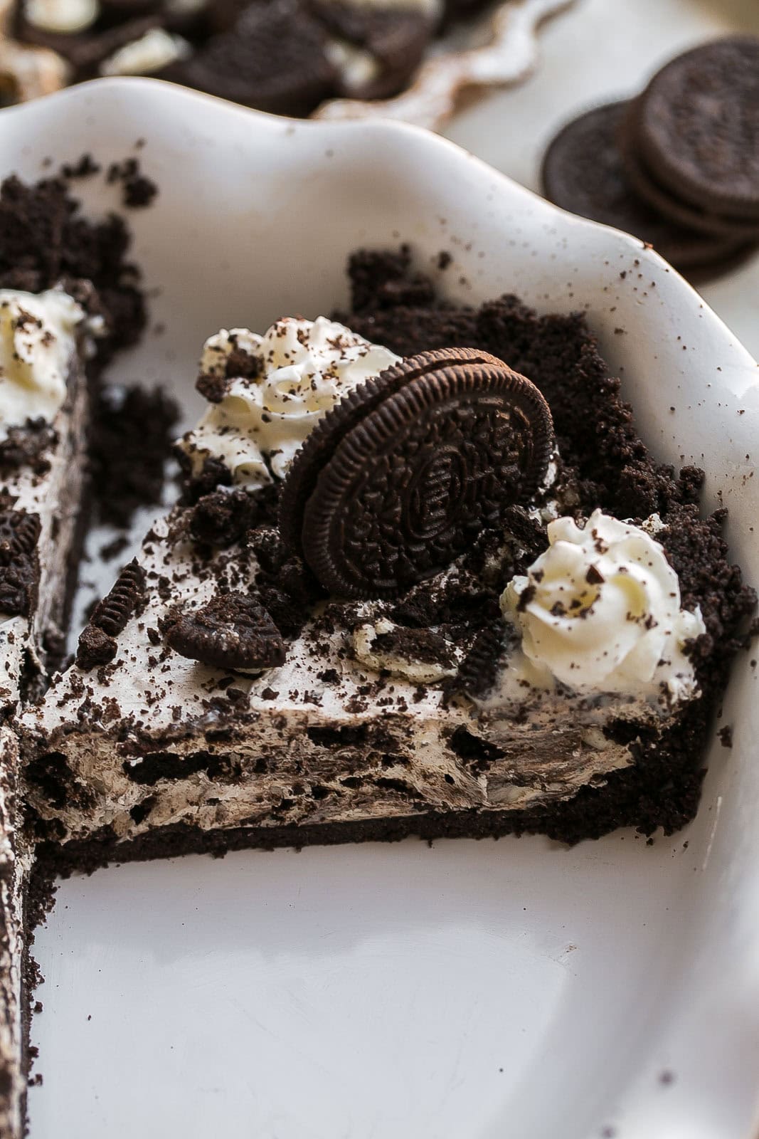 Oreo pie slice in pie dish.